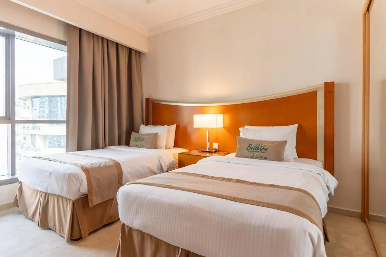 Bed in Grand Bellevue Hotel Apartment Dubai