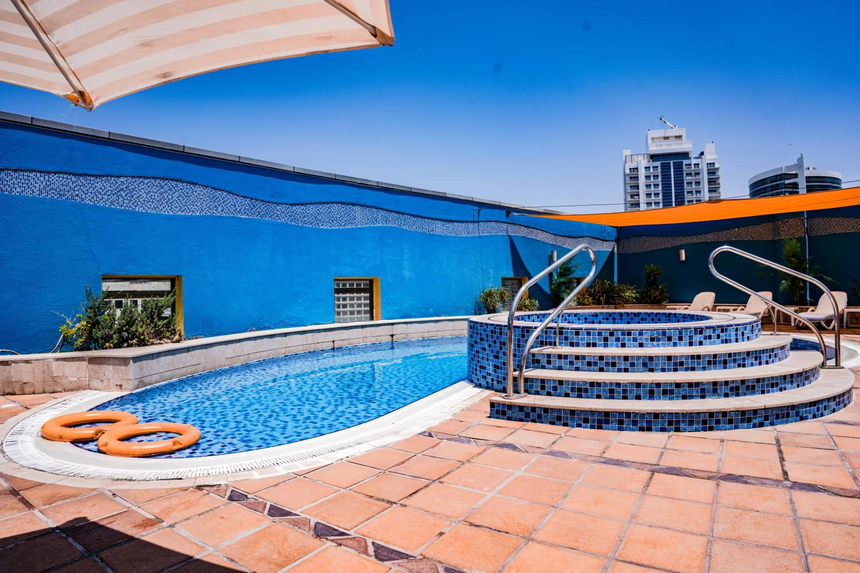Swimming pool in Grand Bellevue Hotel Apartment Dubai