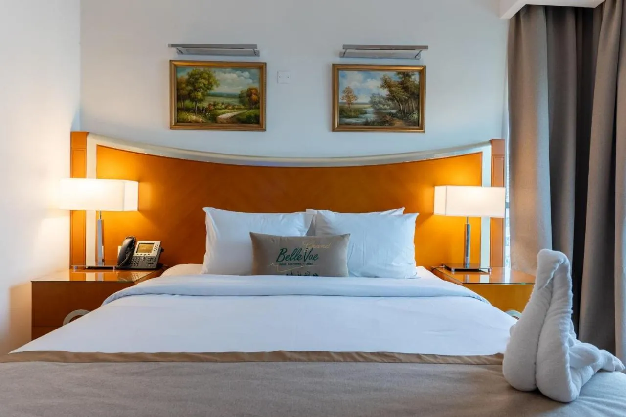 Bed in Grand Bellevue Hotel Apartment Dubai