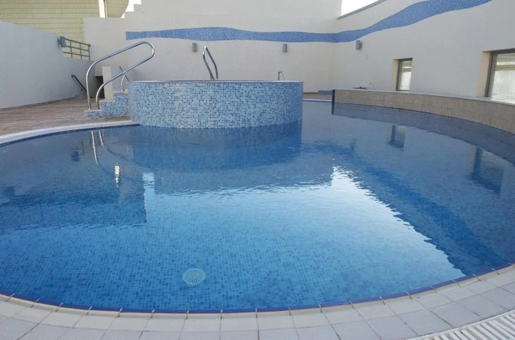 Swimming pool in Grand Bellevue Hotel Apartment Dubai