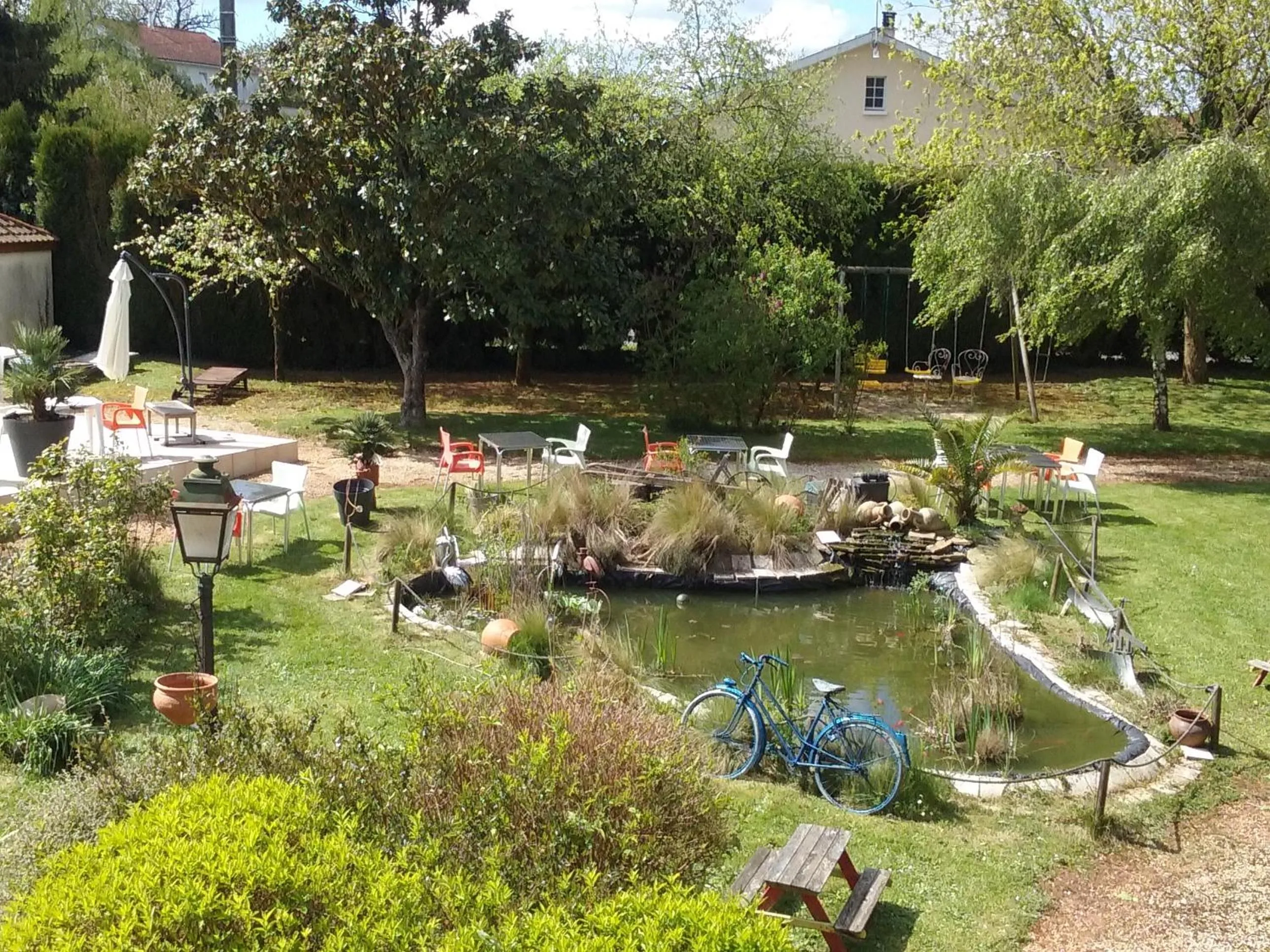 Garden view in Hotel du Commerce Chez Stéphane