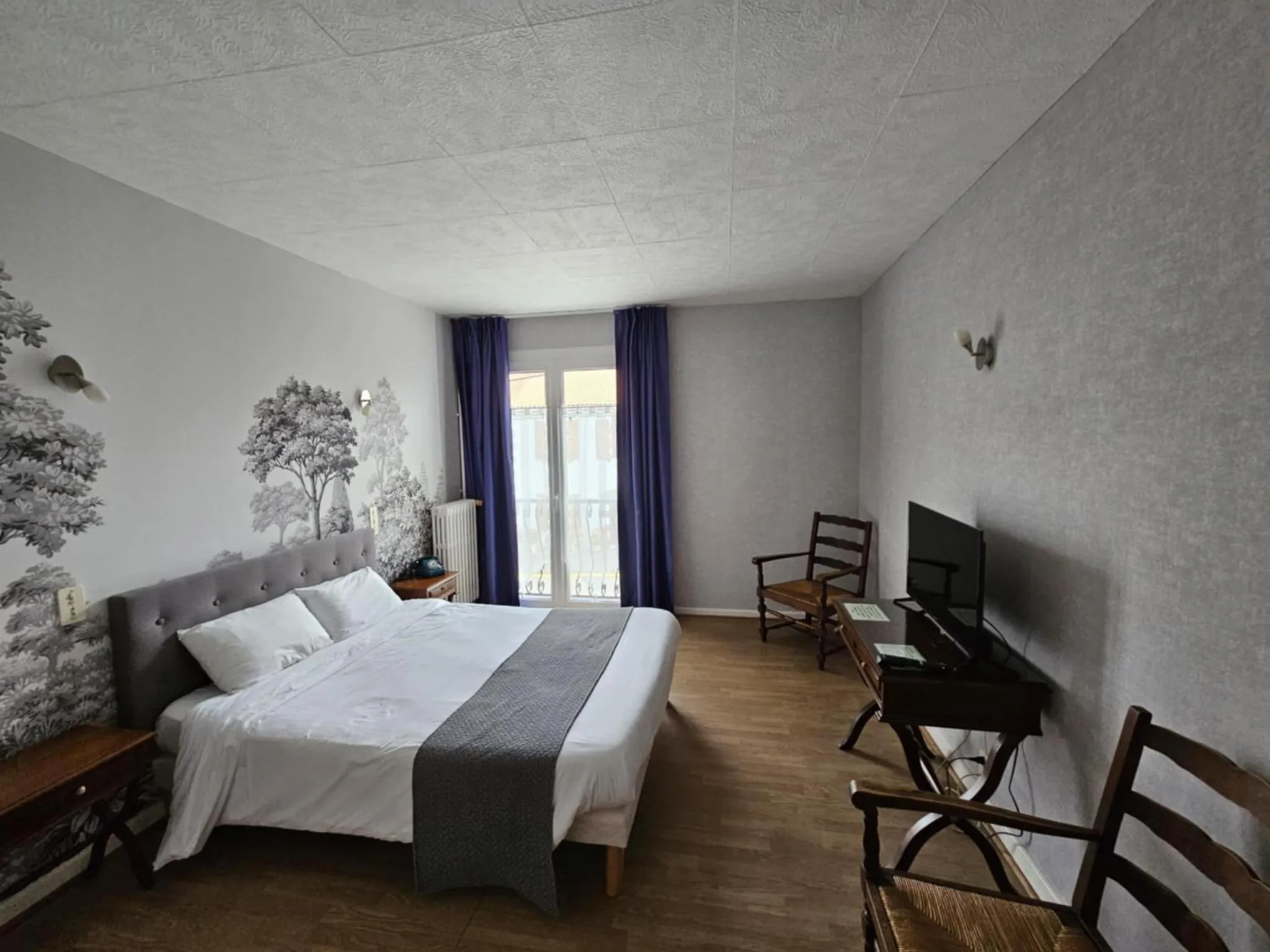 Bed in Hotel du Commerce Chez Stéphane