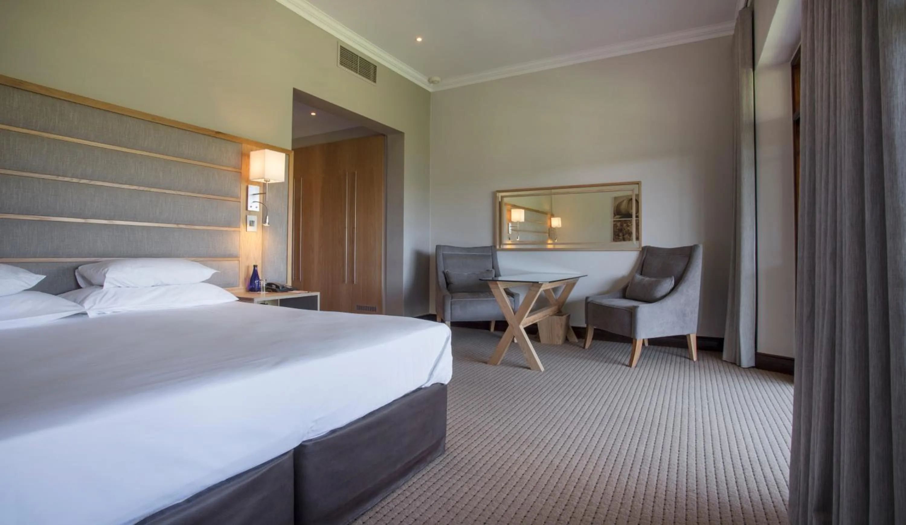 Seating area, Bed in ASARA Wine Estate & Hotel