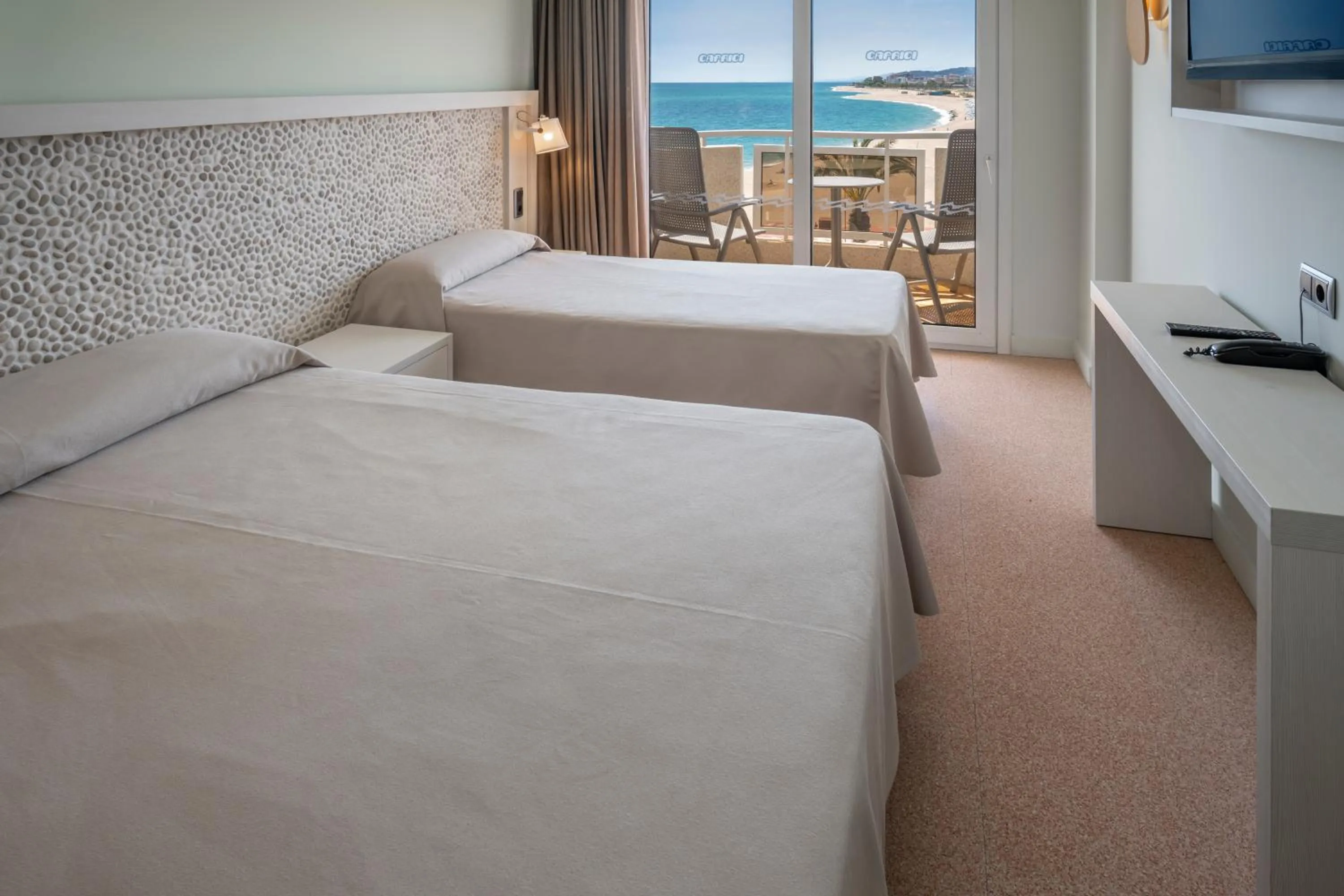 Bed in Caprici Beach Hotel & Spa
