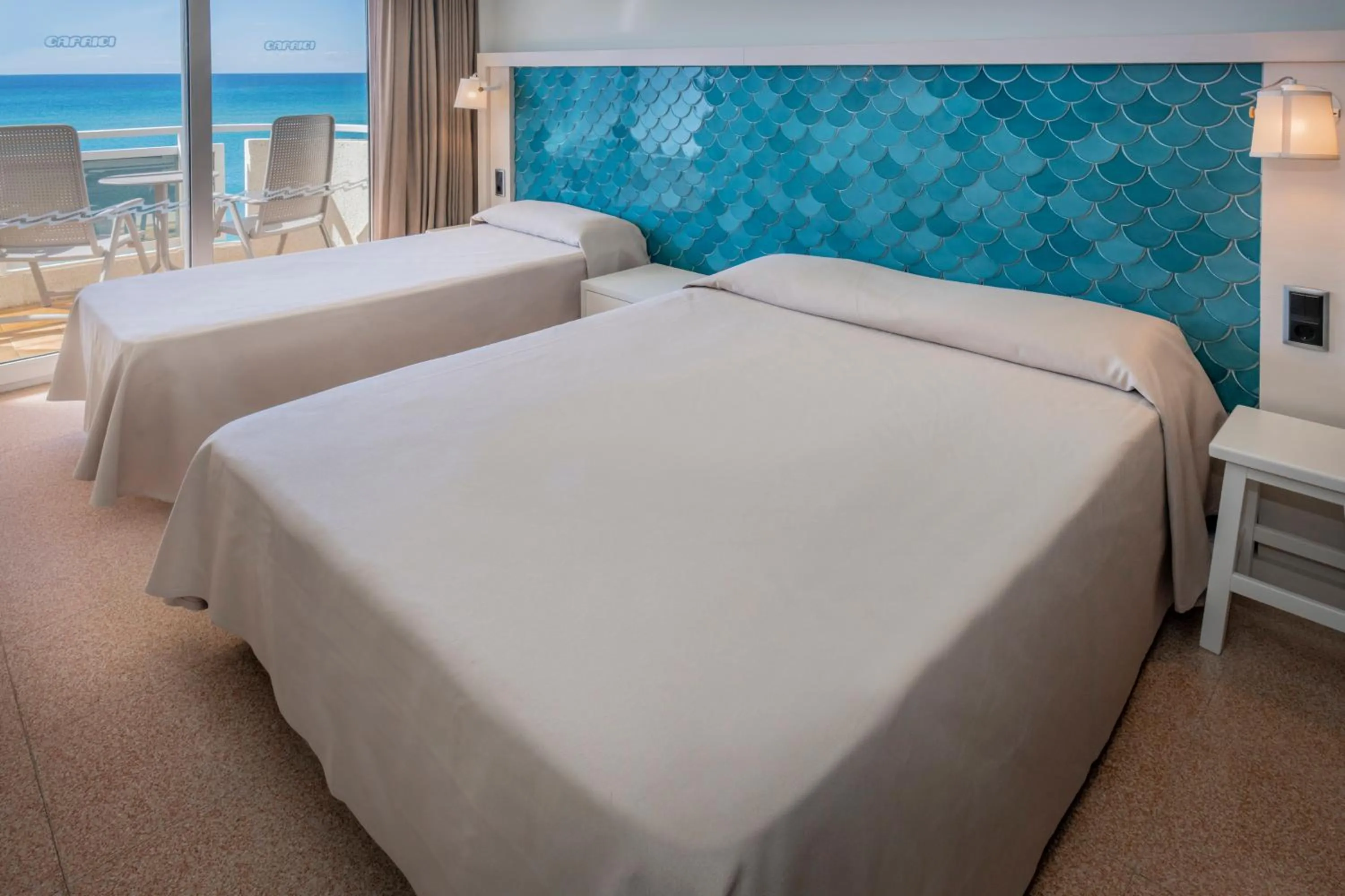 Bed in Caprici Beach Hotel & Spa
