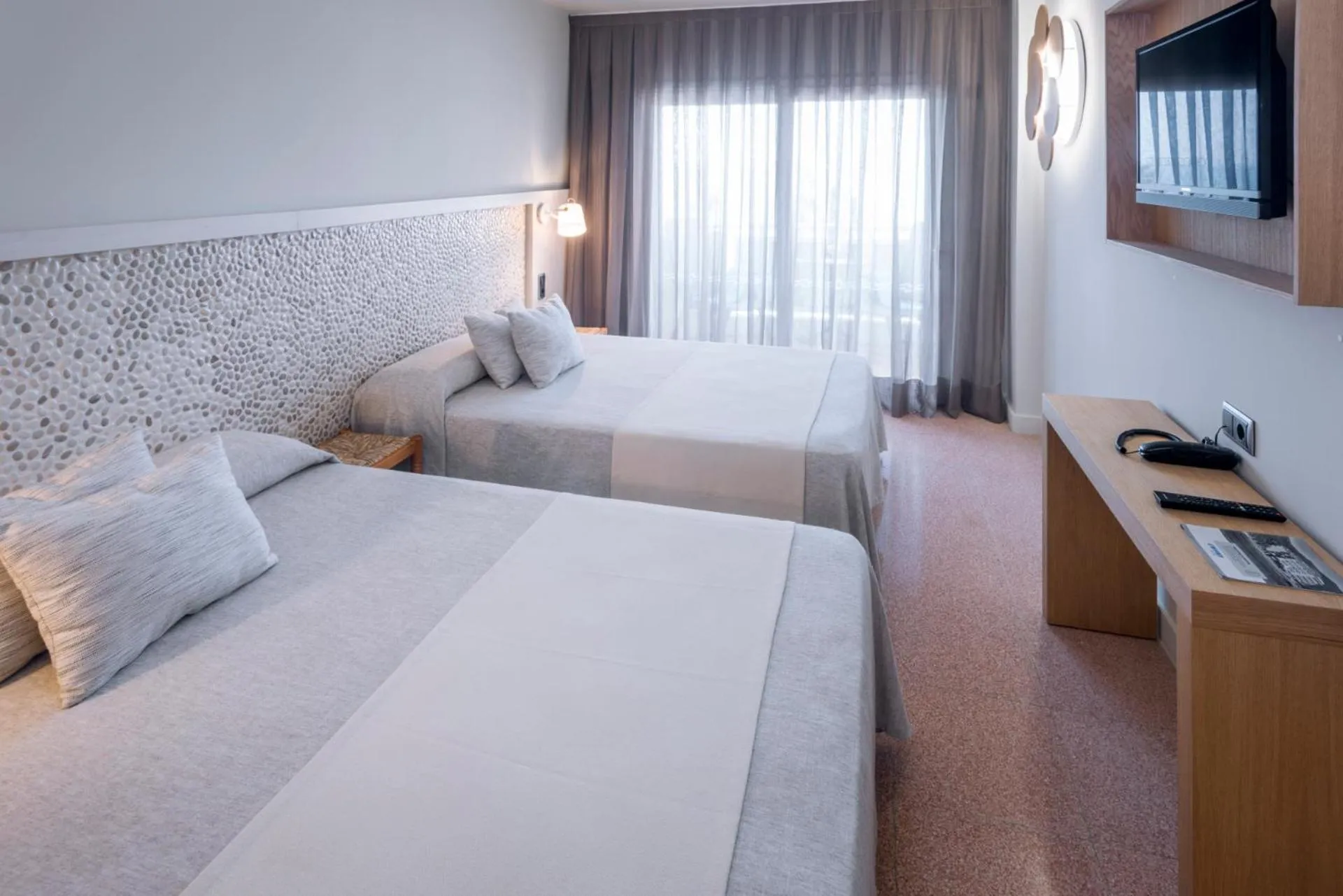 Bed in Caprici Beach Hotel & Spa