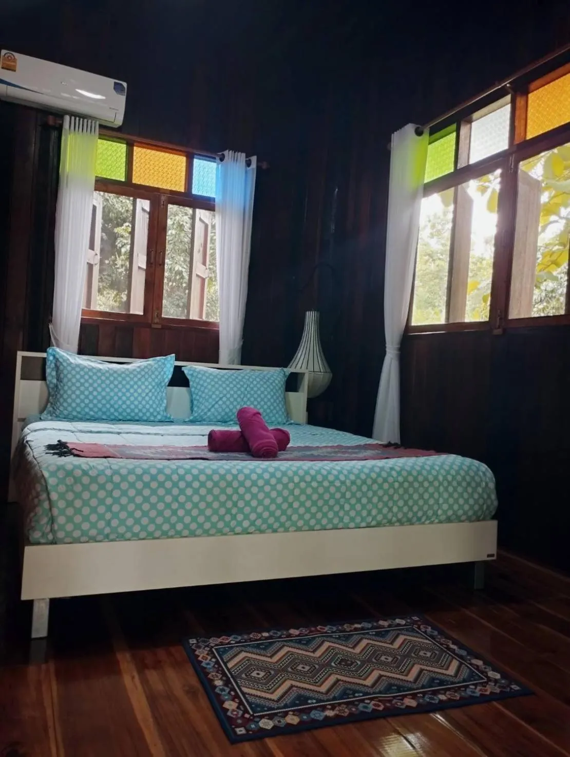 Bed in Nan De Panna Resort and Spa