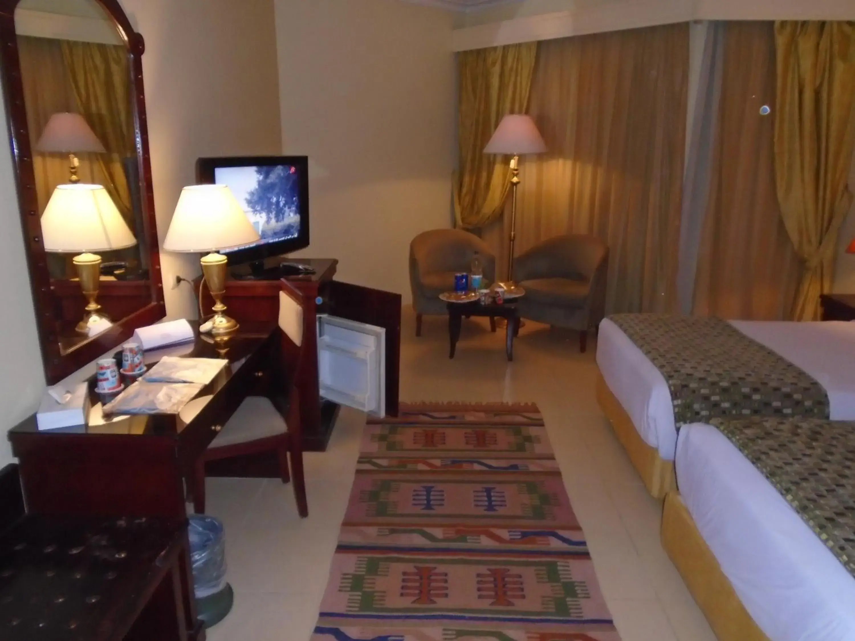 Seating area, Bed in Grand Pyramids Hotel