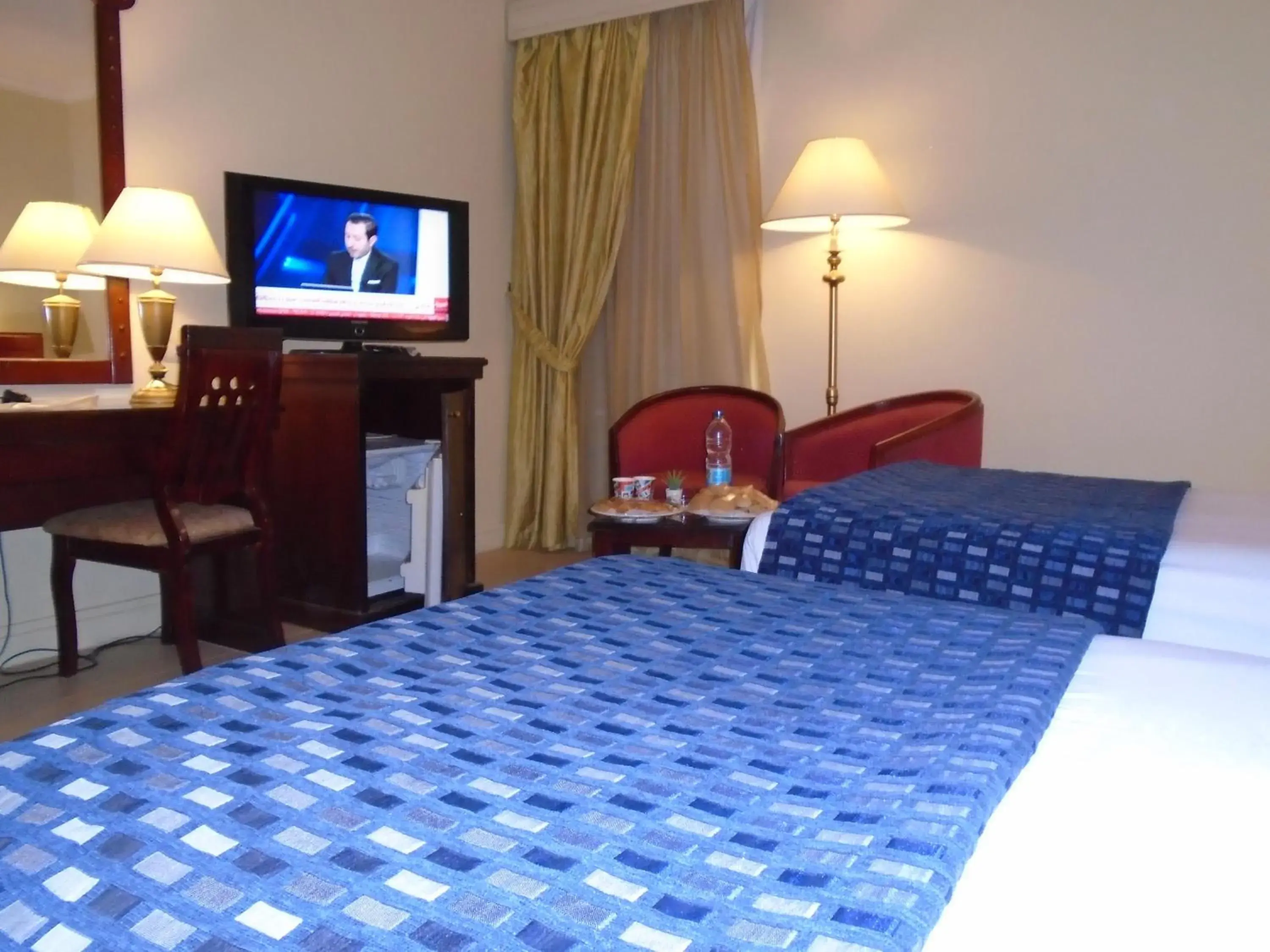 Seating area, Bed in Grand Pyramids Hotel