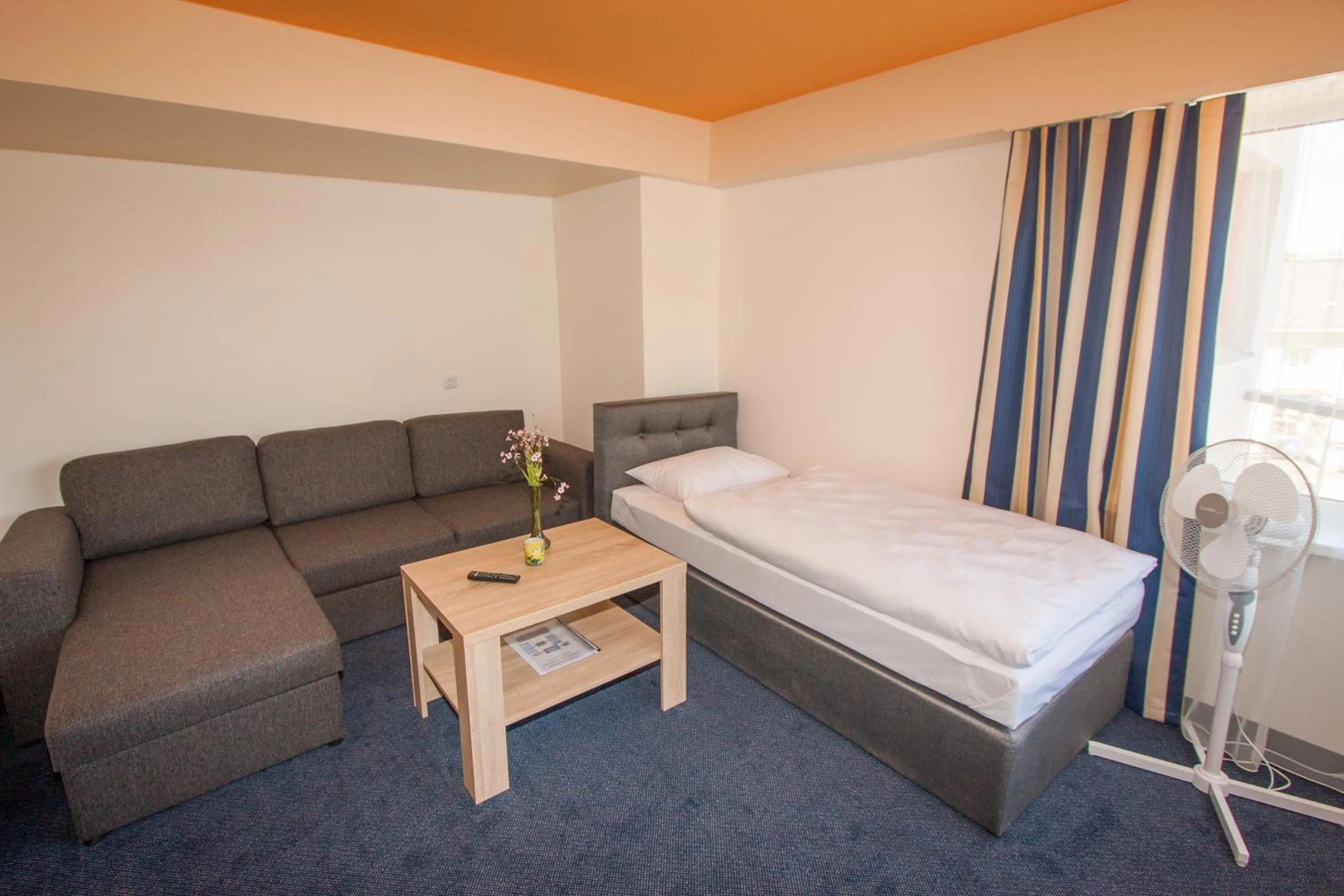 Bed in Tauras Center Hotel