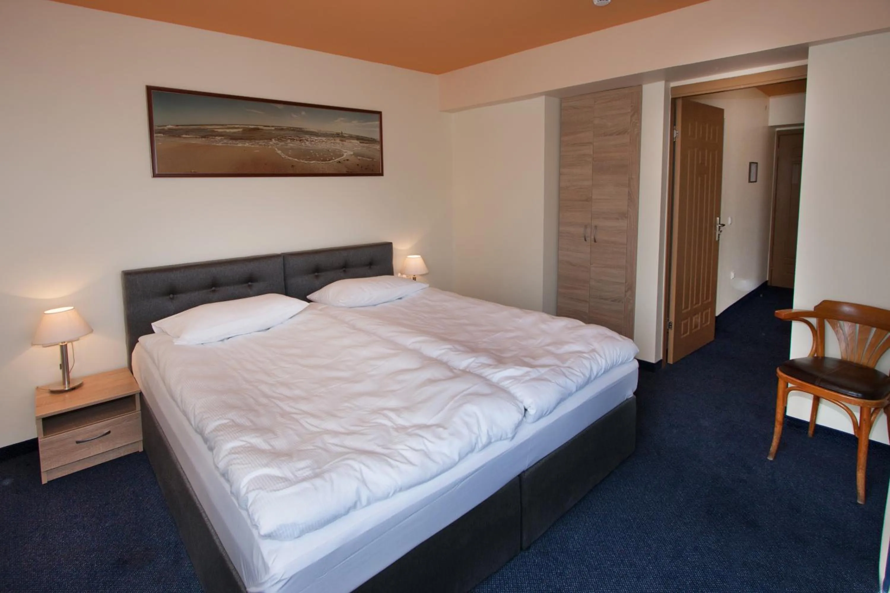 Bed in Tauras Center Hotel