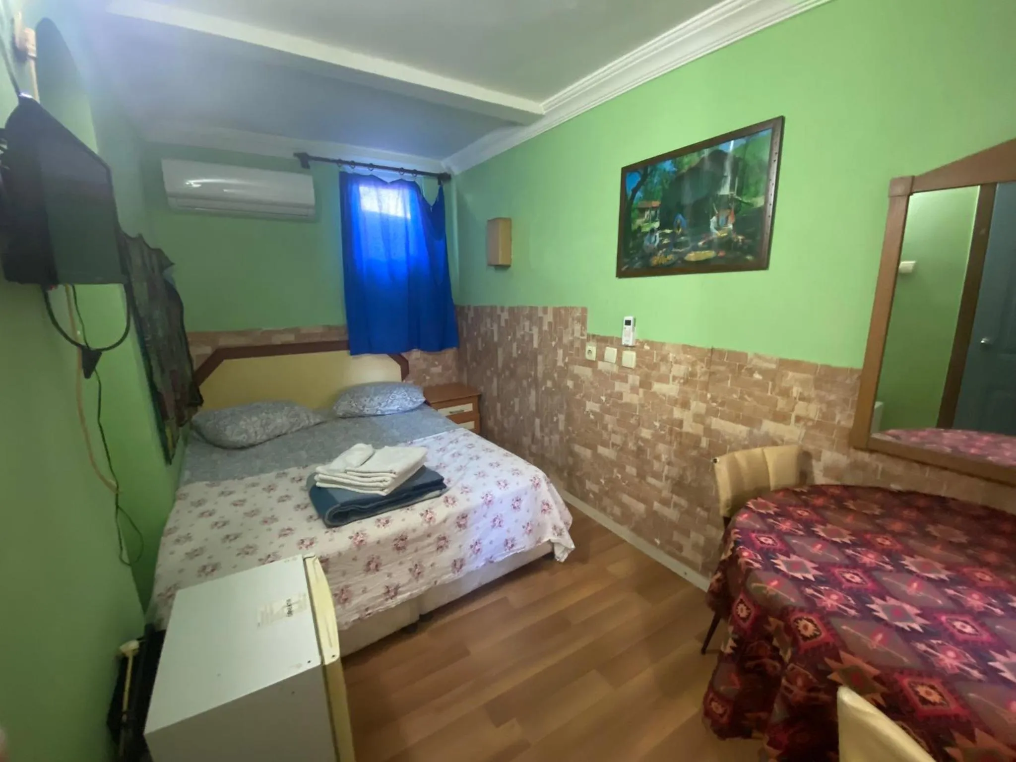 Bed in Camel Hotel & Apart