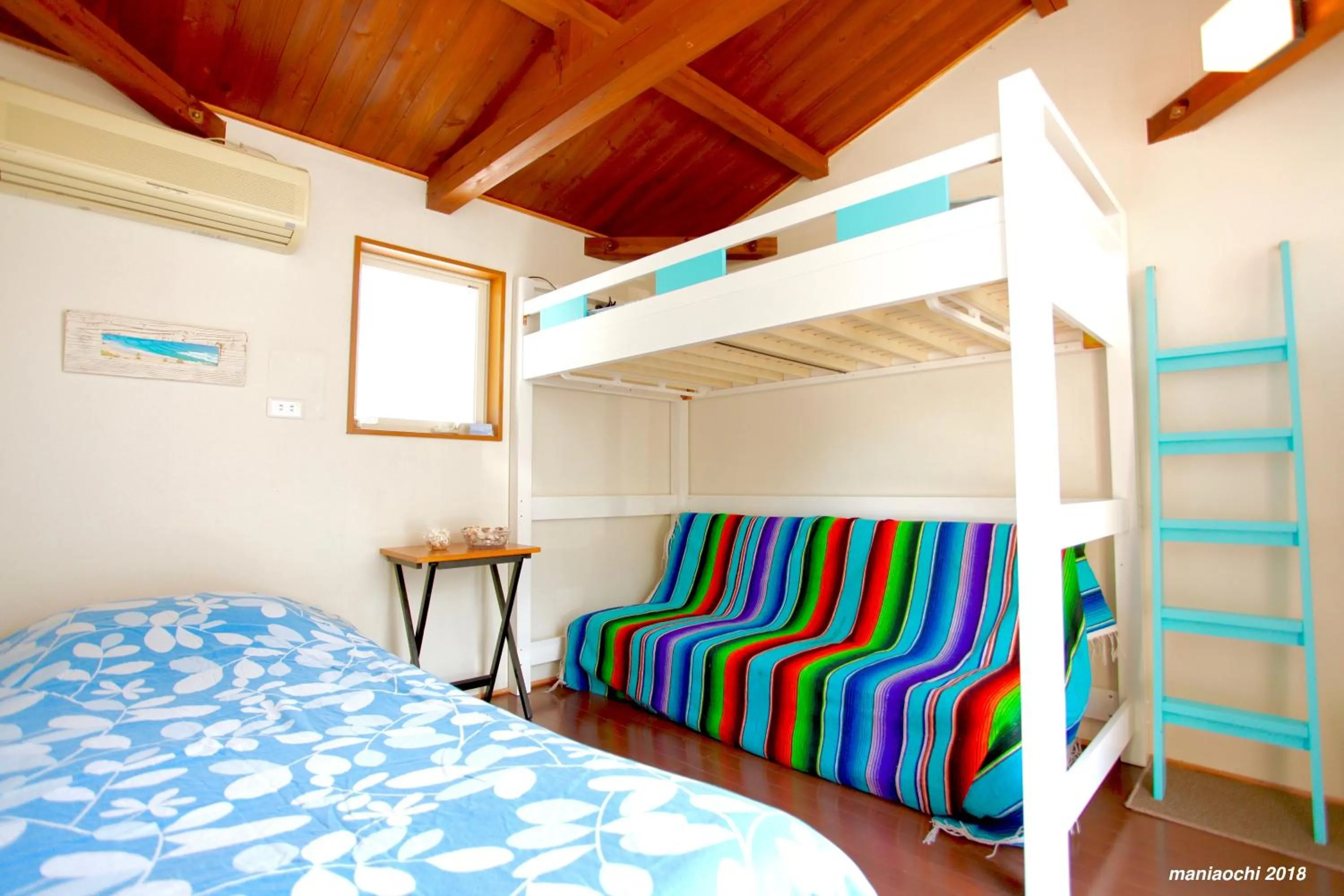 Bed in PavilionSurf&Lodge