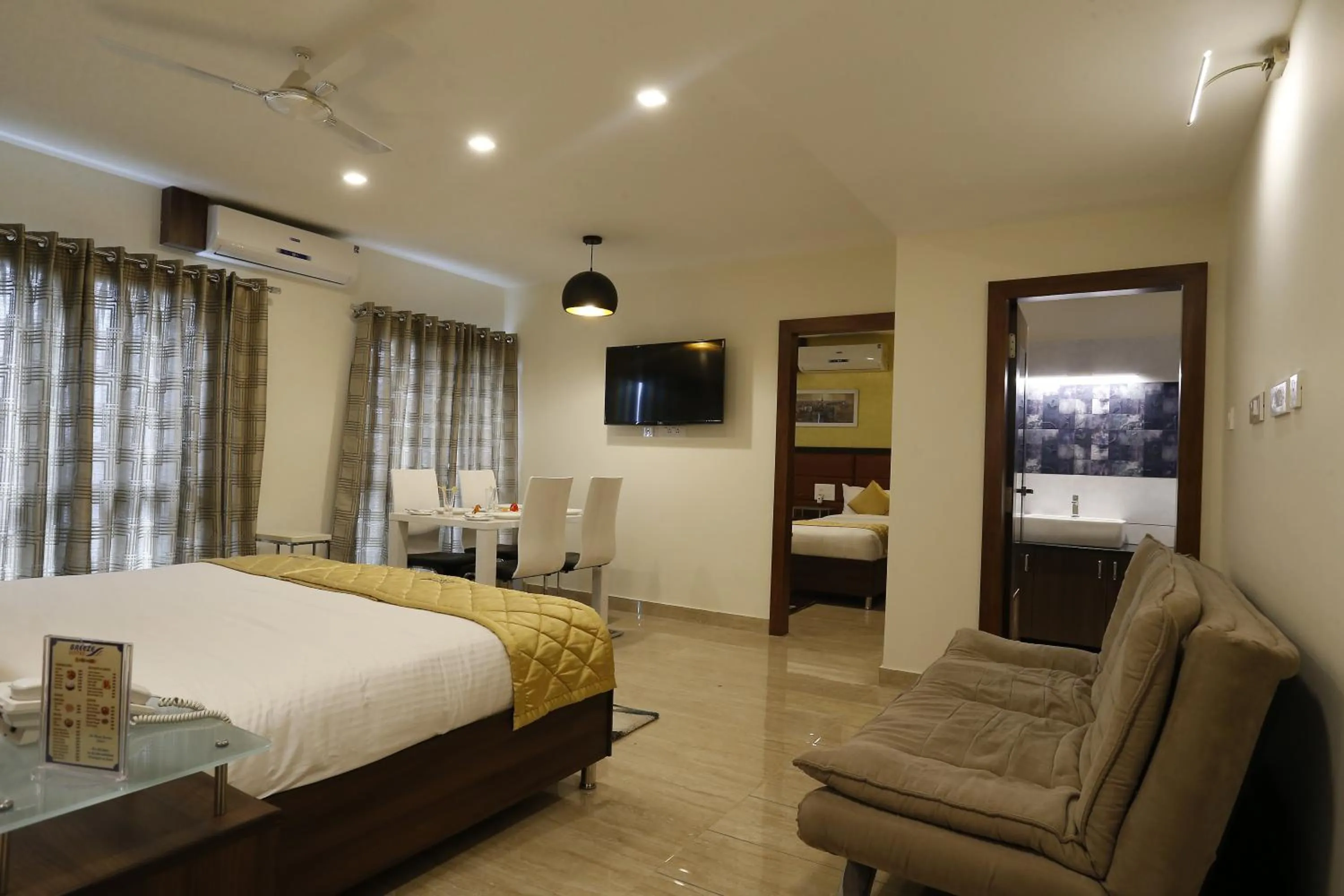 Living room, Bed in D Breeze Suites