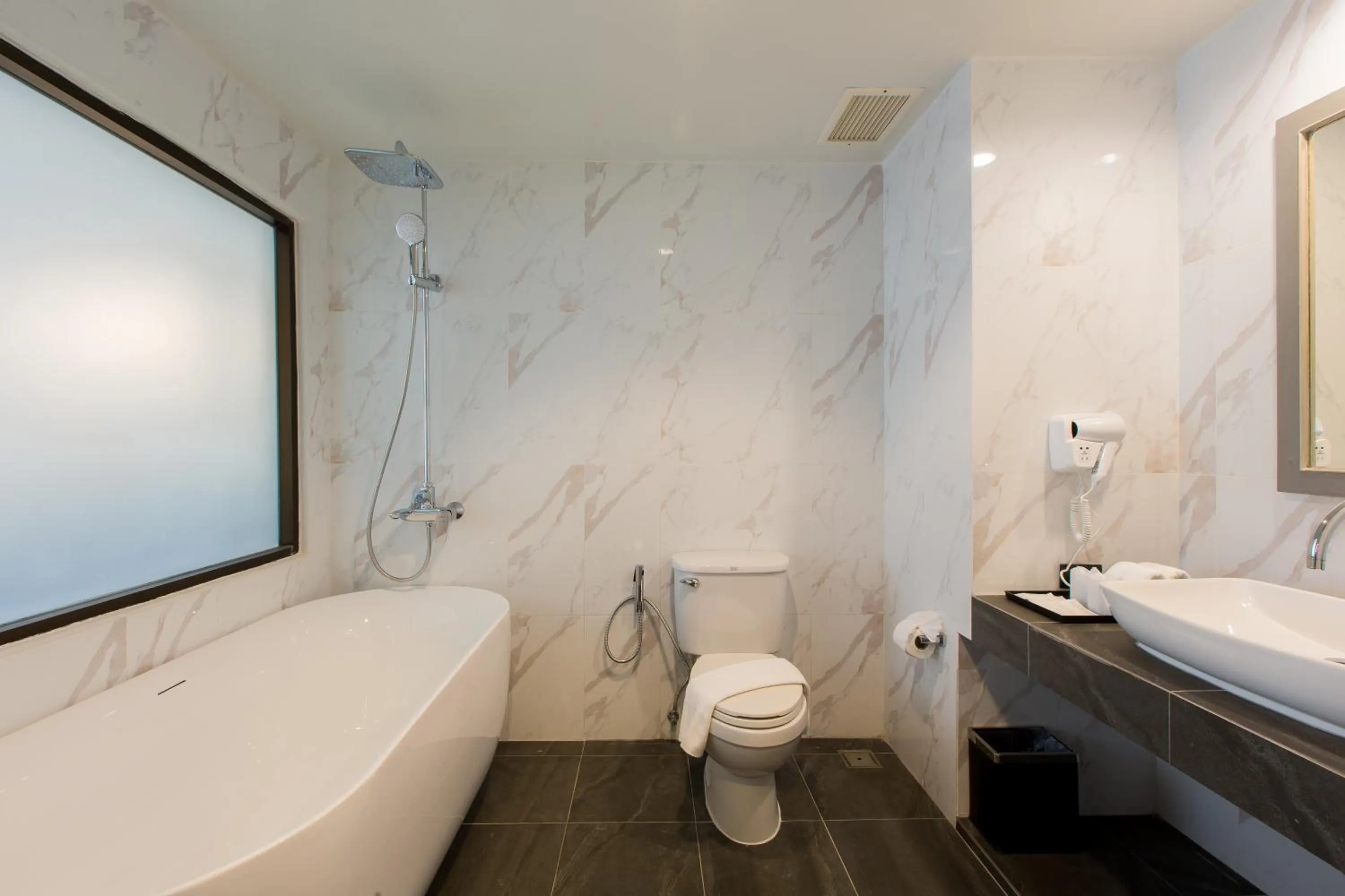 Bathroom, Bed in Coconut Village Resort Phuket - SHA Extra Plus