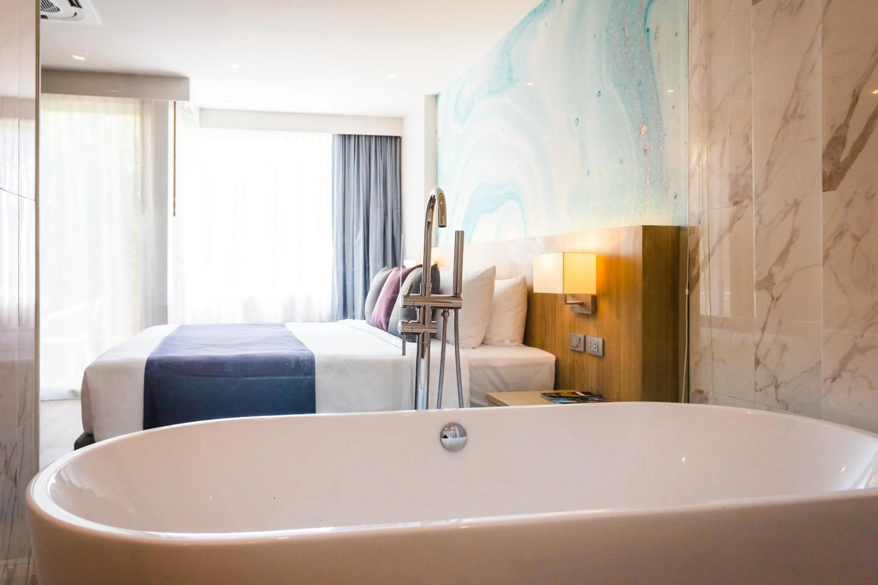 Bathroom, Bed in Coconut Village Resort Phuket - SHA Extra Plus