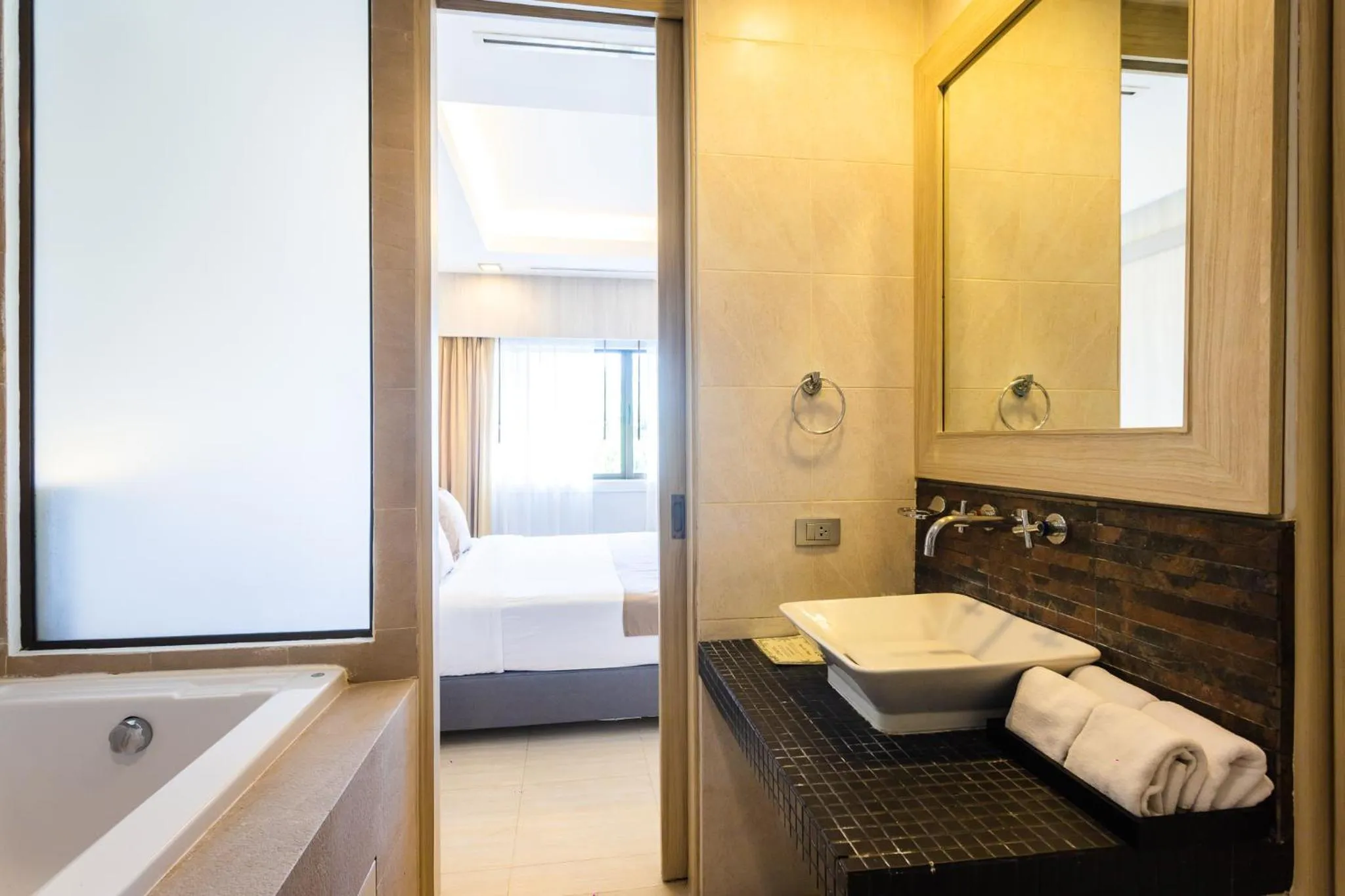 Bathroom, Bed in Coconut Village Resort Phuket - SHA Extra Plus