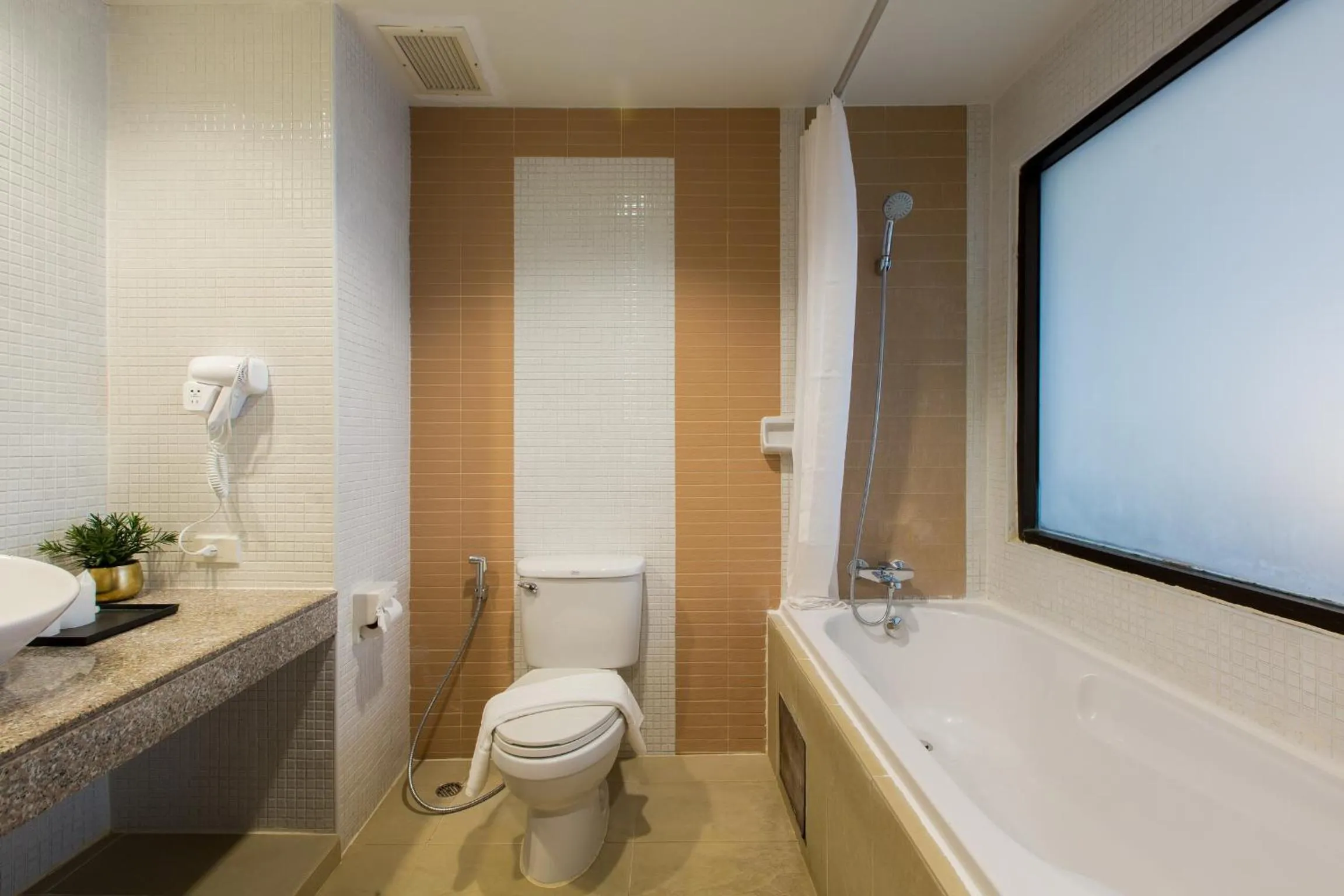 Bathroom in Coconut Village Resort Phuket - SHA Extra Plus