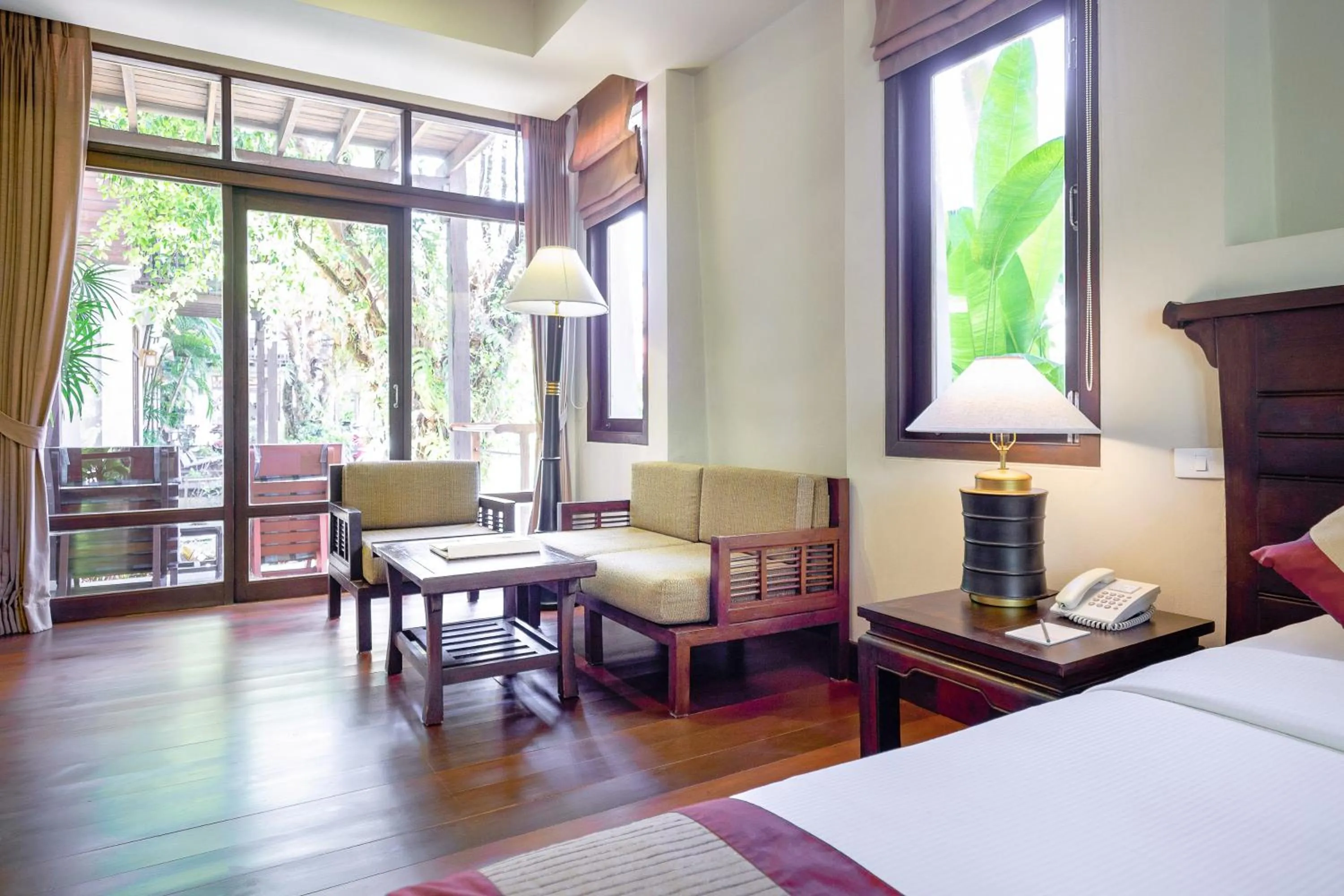 Seating area, Bed in Khaolak Bhandari Resort & Spa