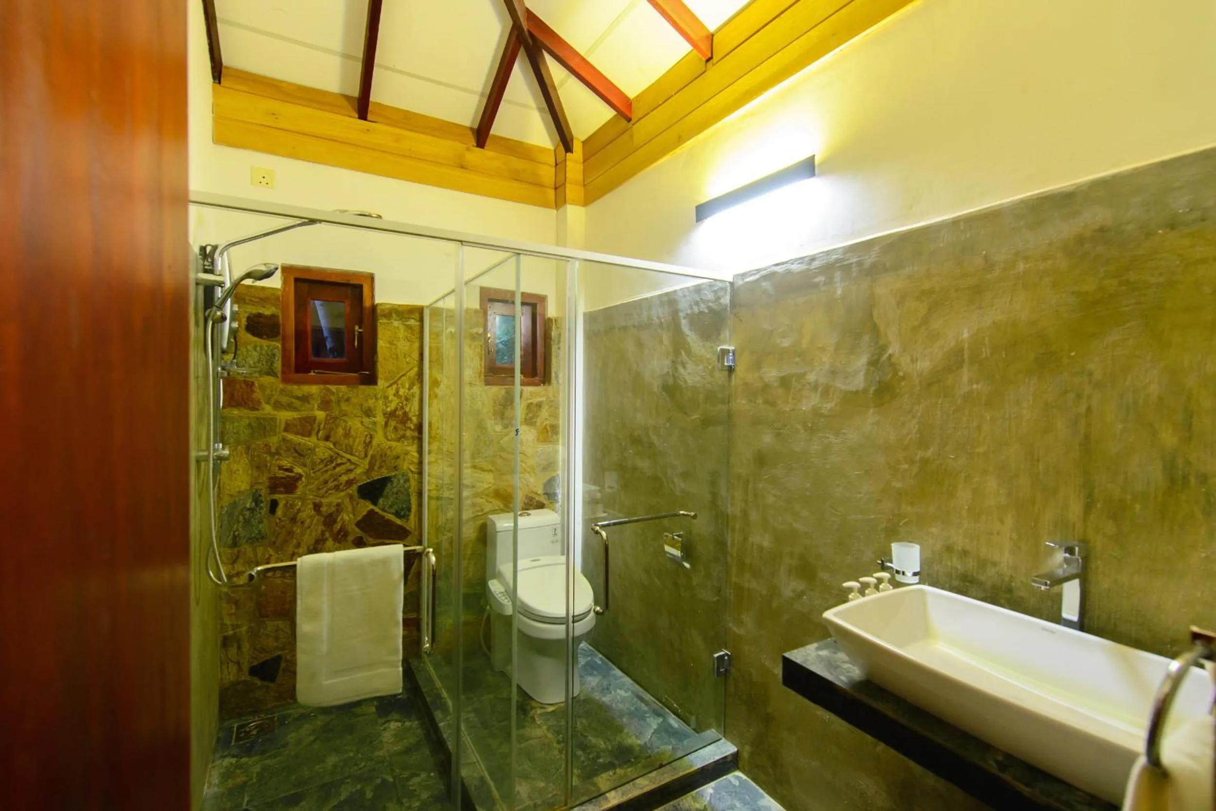 Bathroom in Karunakarala Ayurveda Resort
