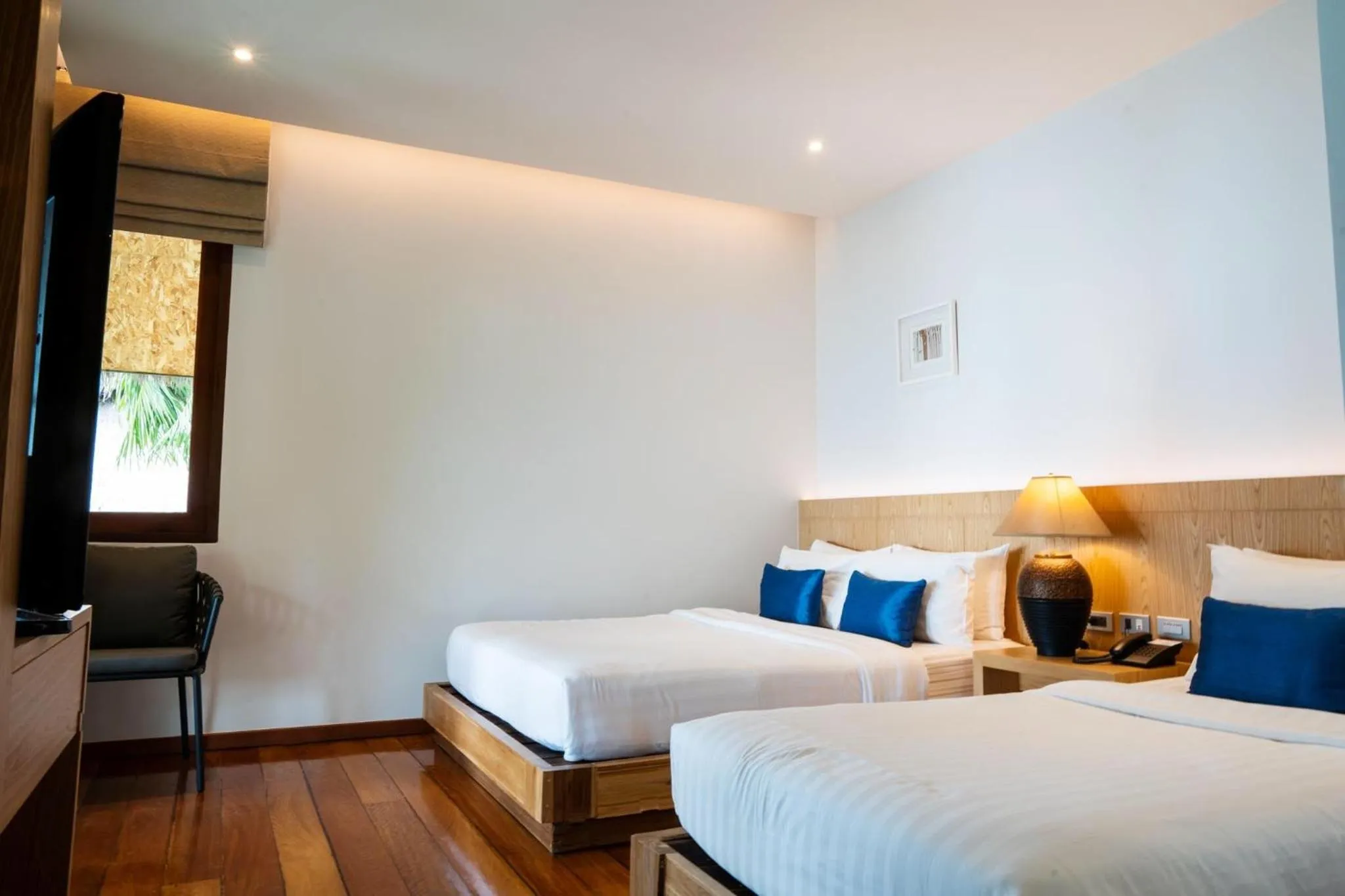 Bed in Coral Cliff Beach Resort Samui - SHA Plus