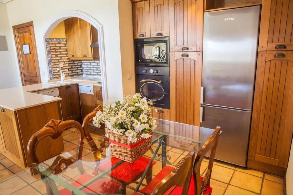 Kitchen or kitchenette in Apartamentos Turísticos Bahía Sur