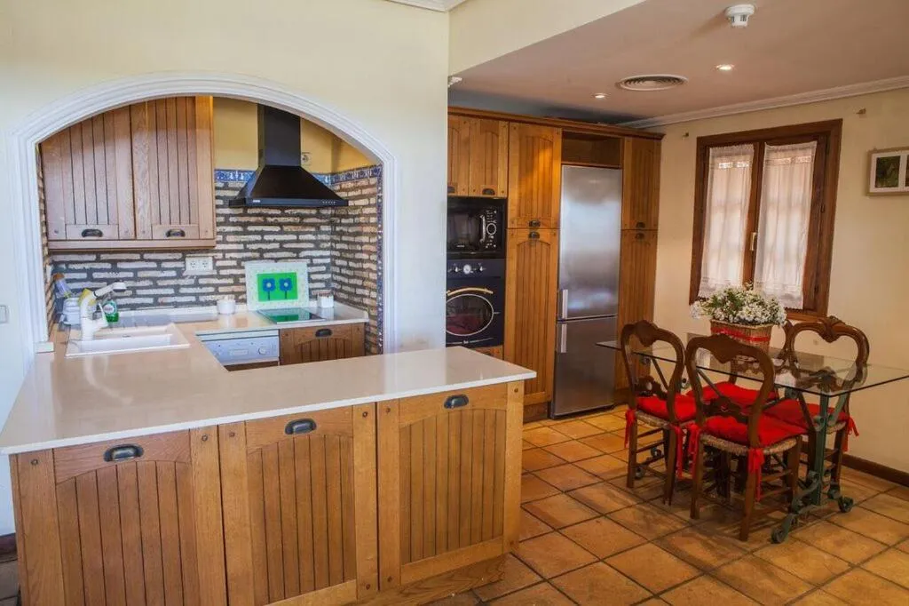 Kitchen or kitchenette in Apartamentos Turísticos Bahía Sur