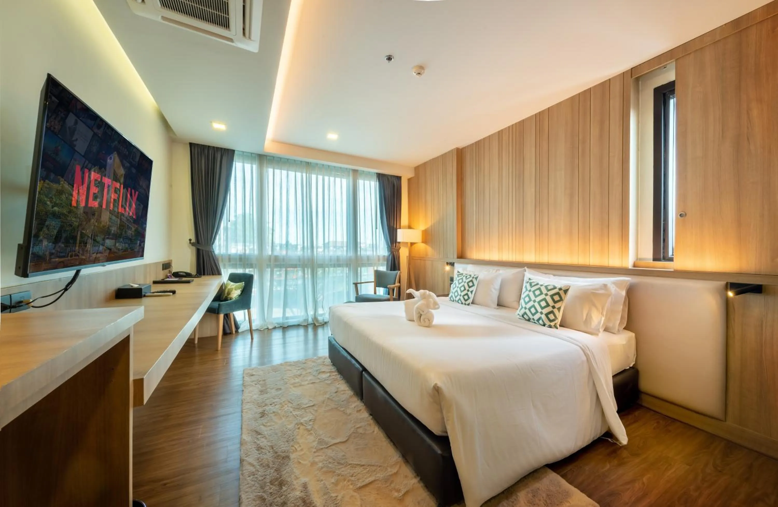 Bed in PLAAI Prime Hotel Rayong SHA Extra Plus