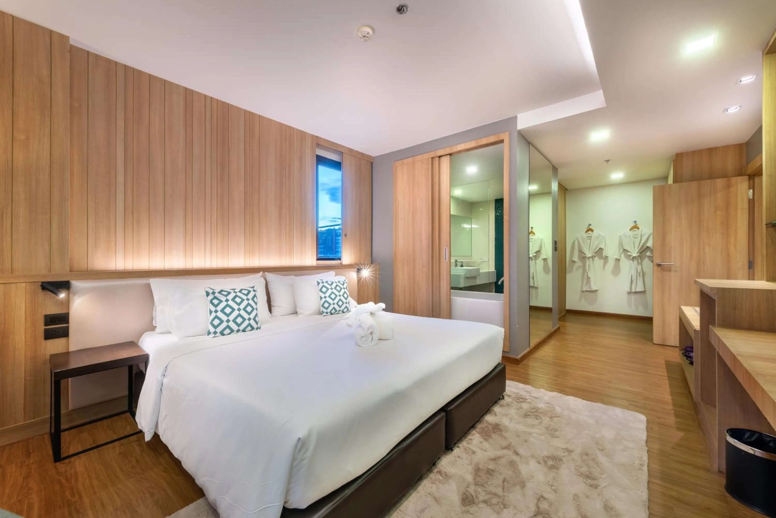 Bed in PLAAI Prime Hotel Rayong SHA Extra Plus
