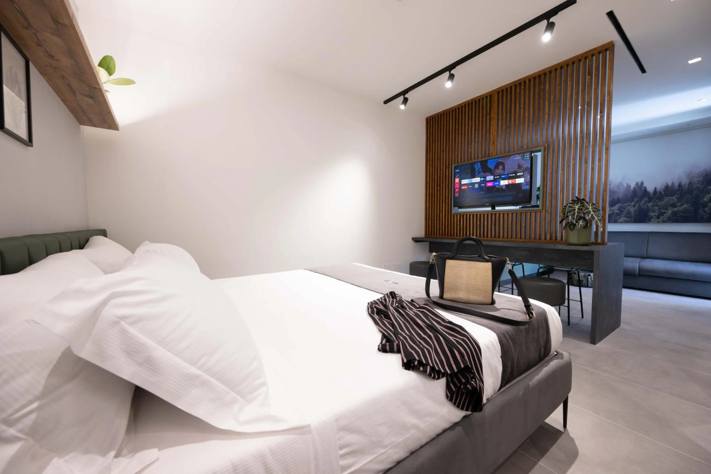 Seating area, Bed in Meg Lifestyle Hotel & Apartaments