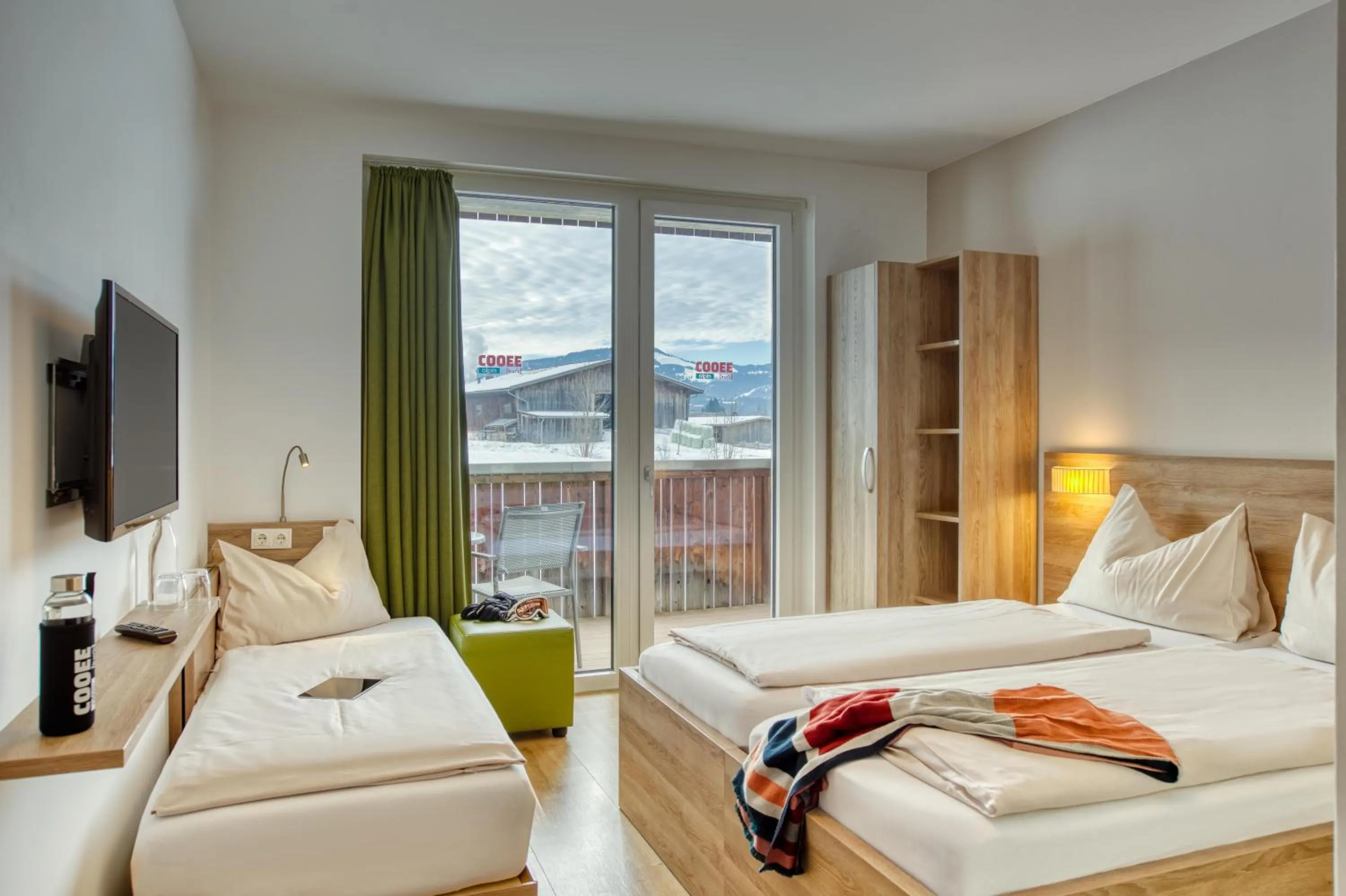 Photo of the whole room, Bed in COOEE alpin Hotel Kitzbüheler Alpen