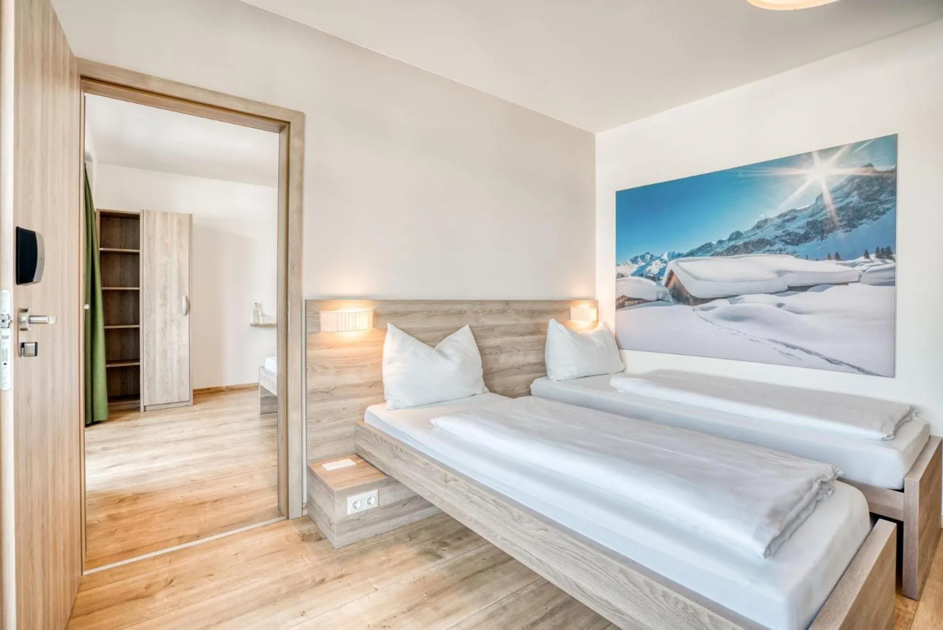 Photo of the whole room, Bed in COOEE alpin Hotel Kitzbüheler Alpen