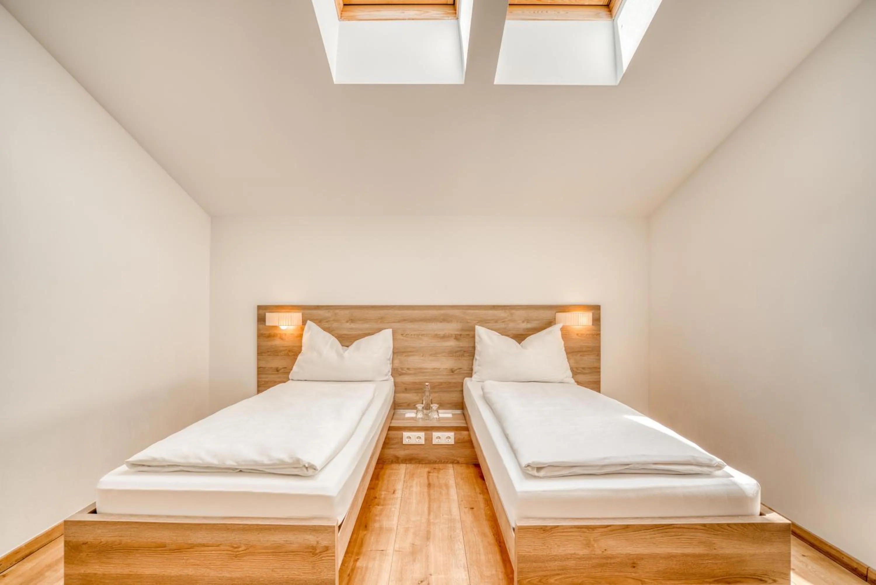 Bed in COOEE alpin Hotel Kitzbüheler Alpen