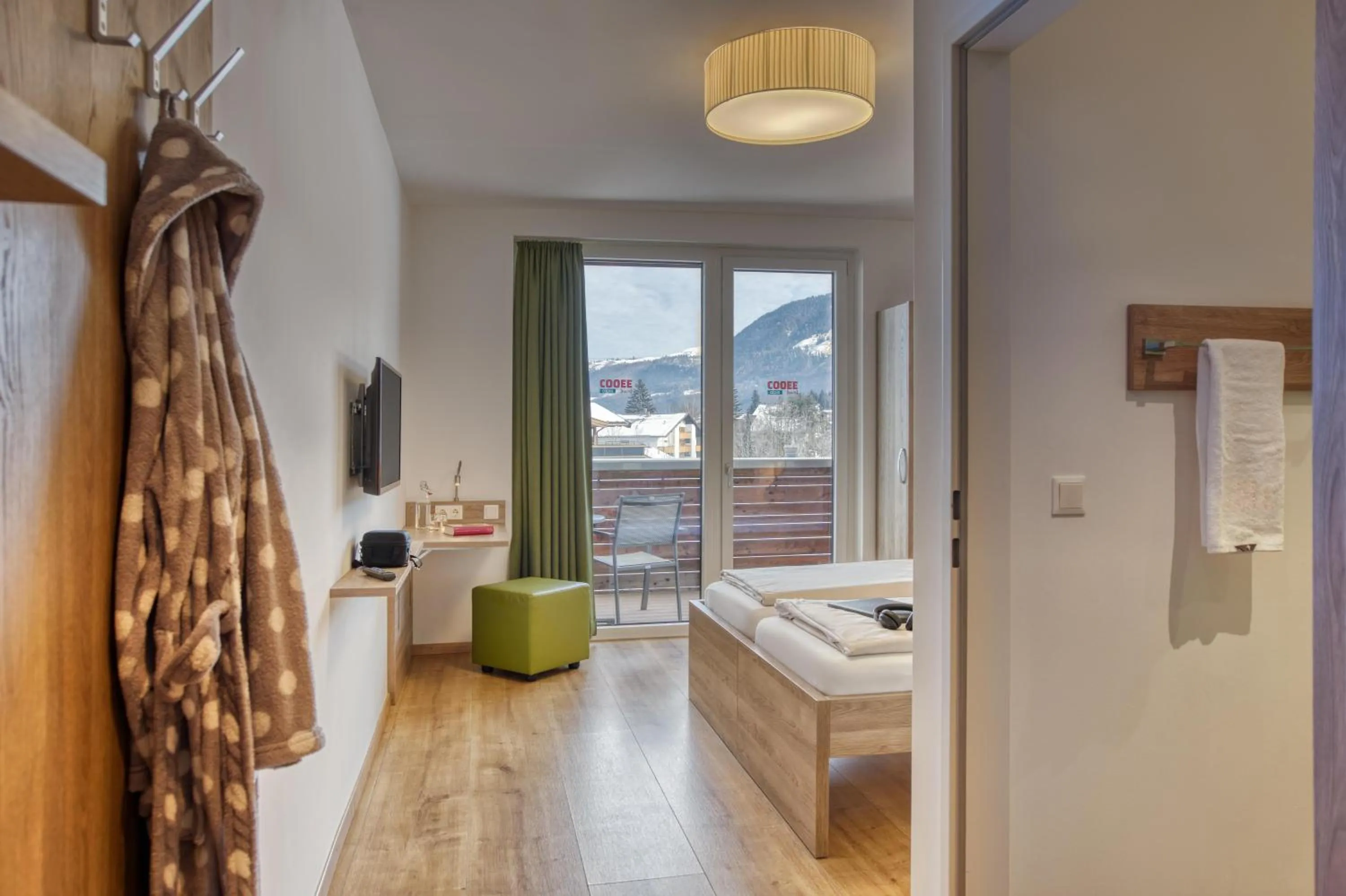 Photo of the whole room, Bed in COOEE alpin Hotel Kitzbüheler Alpen
