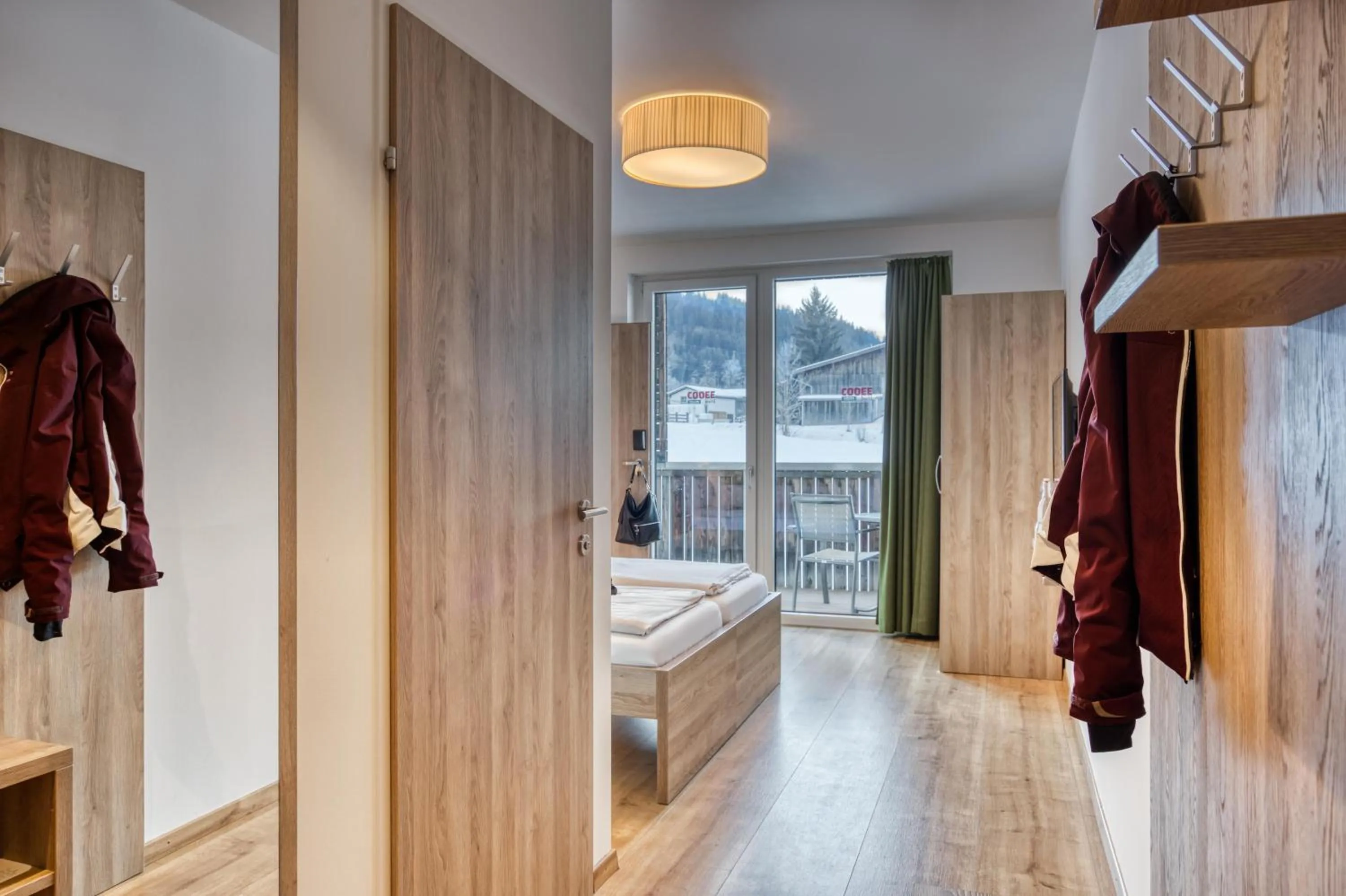 Photo of the whole room, Bed in COOEE alpin Hotel Kitzbüheler Alpen