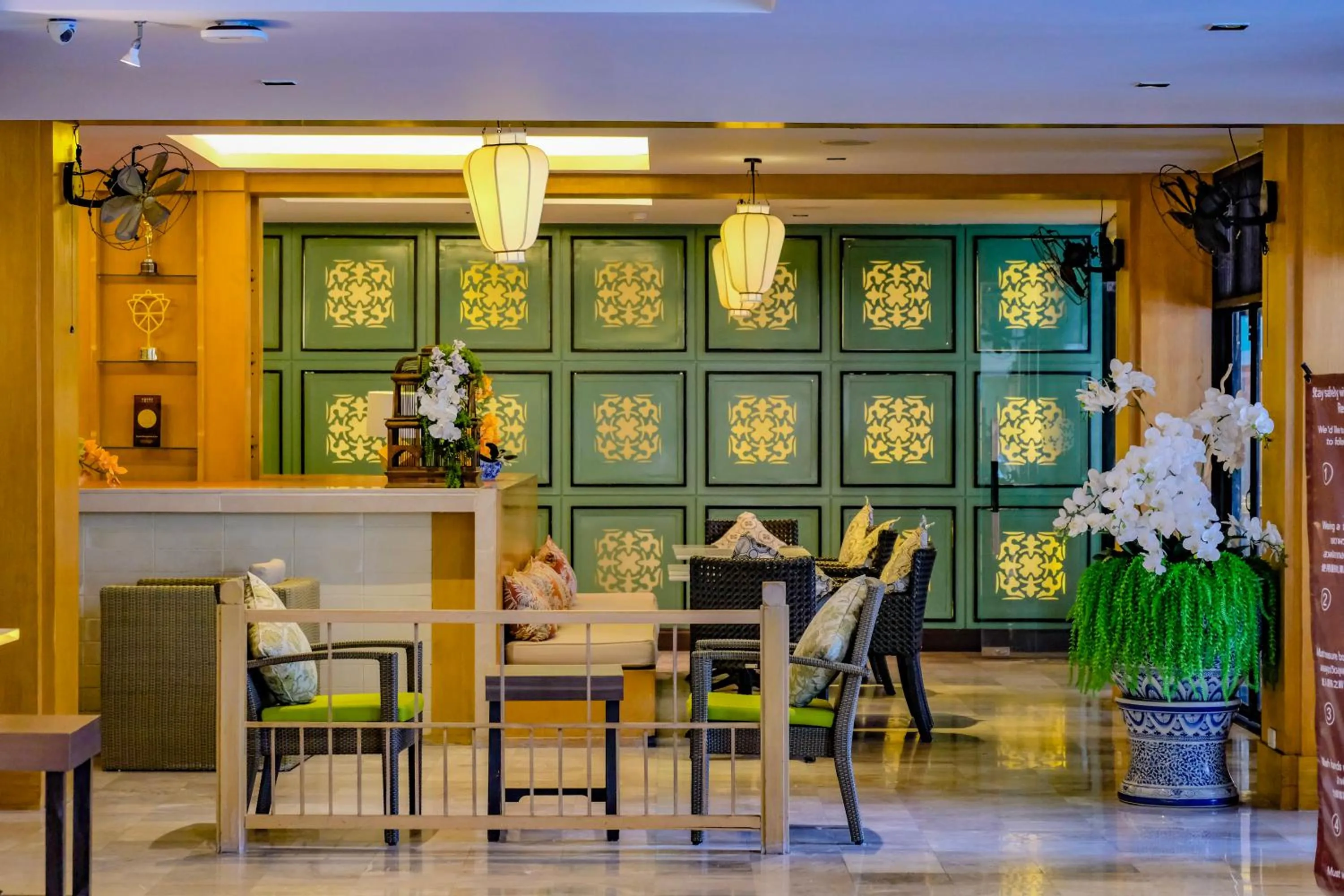 Seating area in Sawaddi Patong Resort & Spa by Tolani