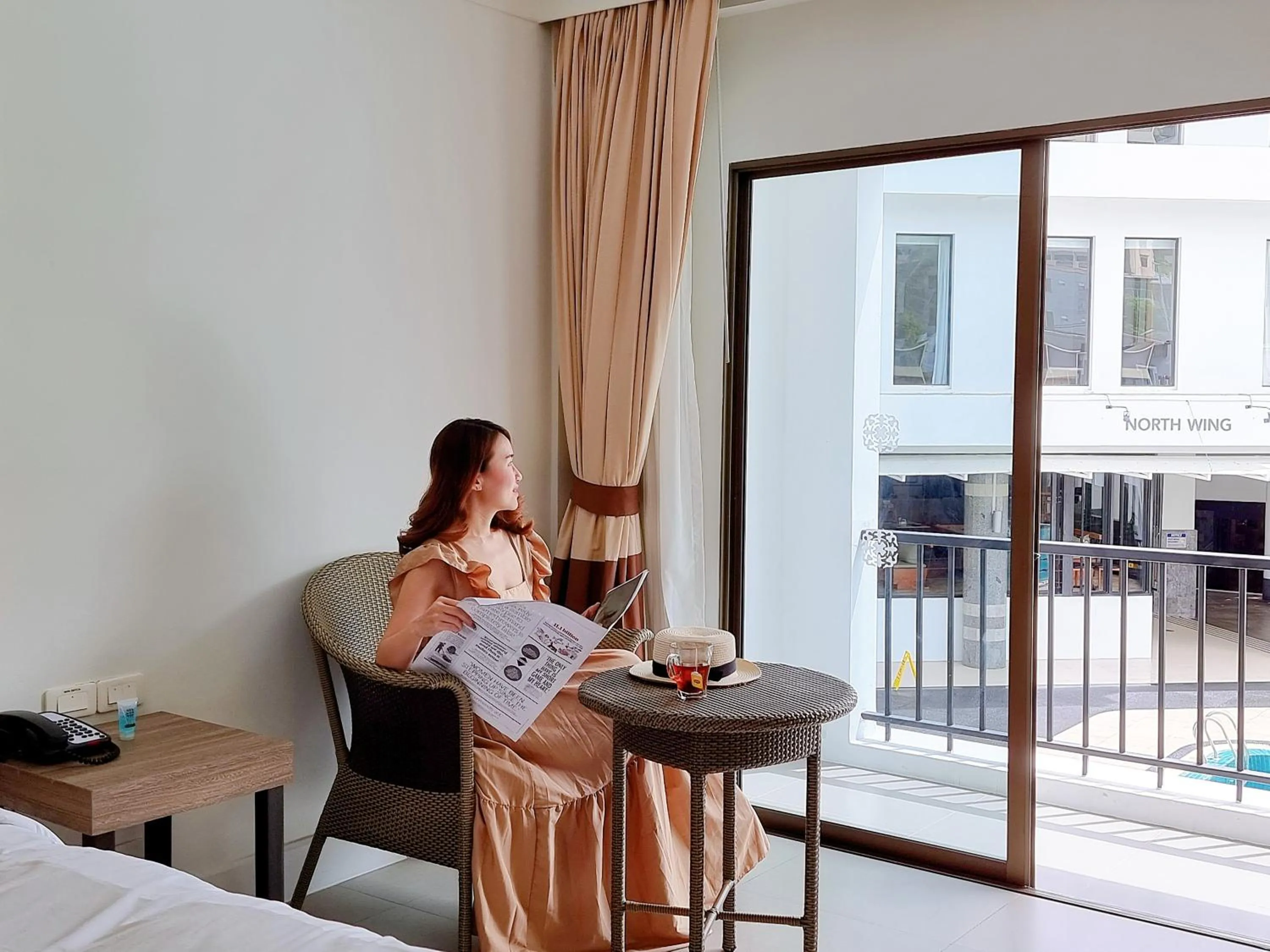 Seating area in Sawaddi Patong Resort & Spa by Tolani