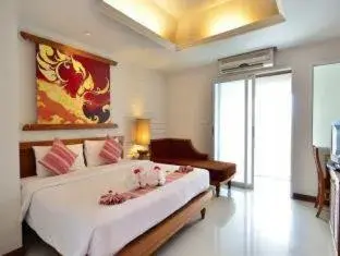 Bed in First Bungalow Beach Resort Bed in First Bungalow Beach Resort