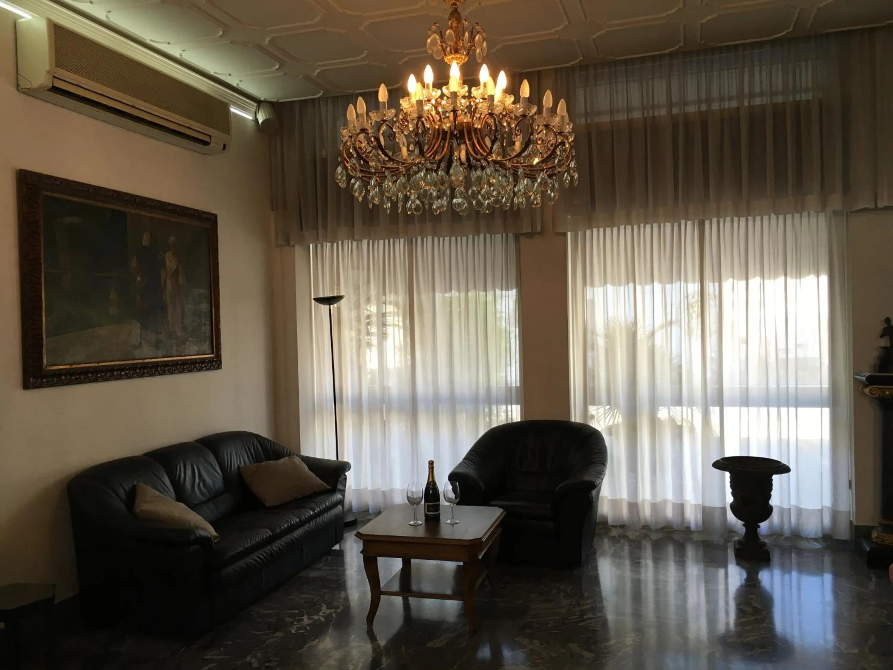 Communal lounge/ TV room in Hotel Minerva