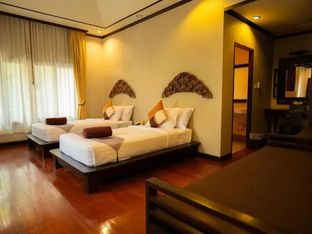 Bed in Kanok Buri Resort