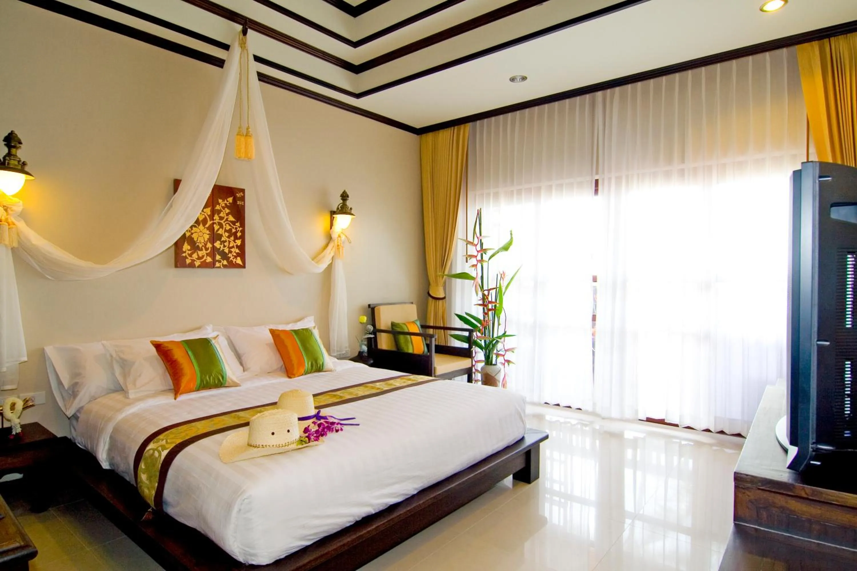 Bed in Kanok Buri Resort