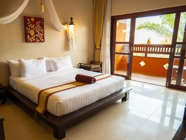 Bed in Kanok Buri Resort