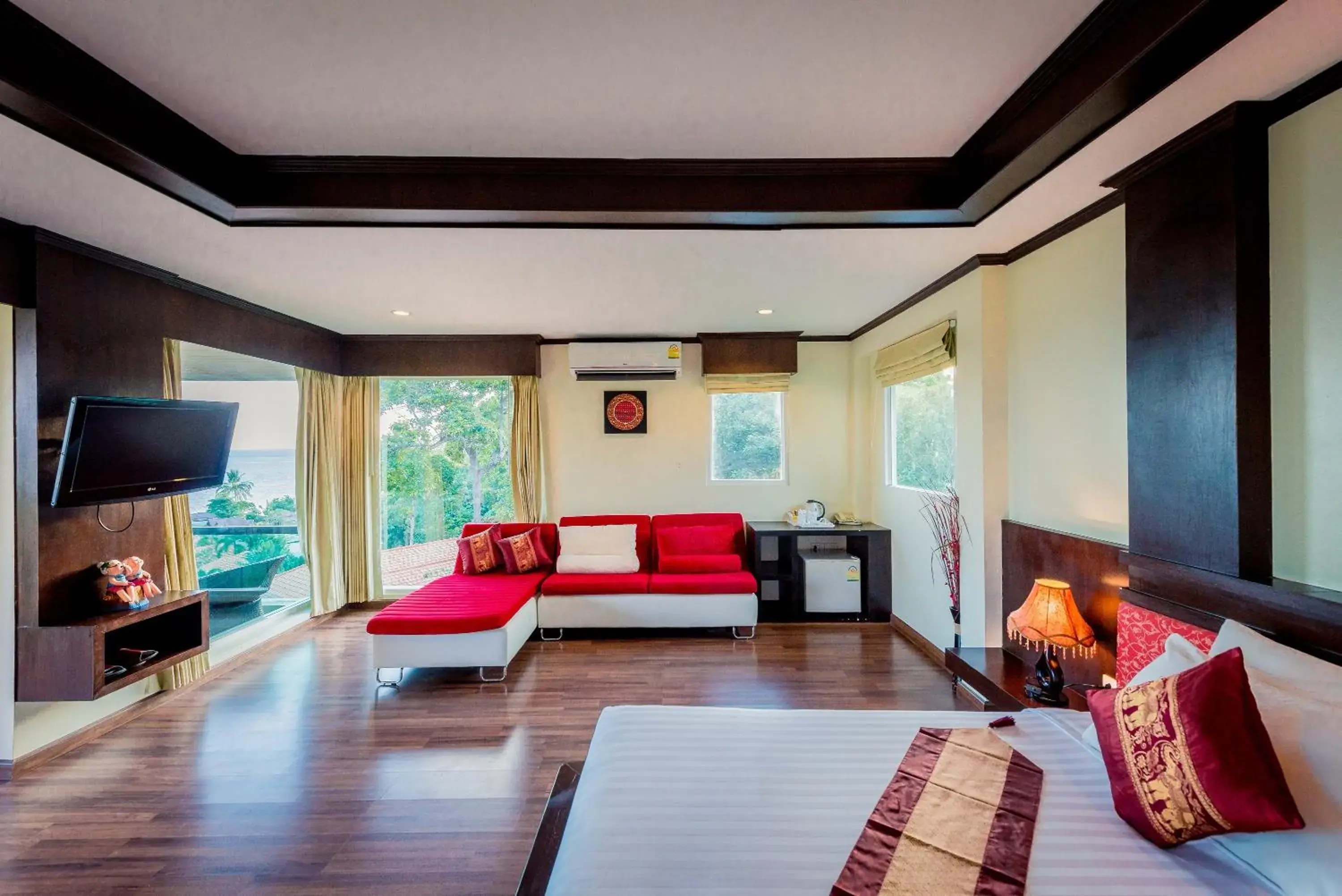 Seating area, Bed in Sita Beach Resort Seating area, Bed in Sita Beach Resort