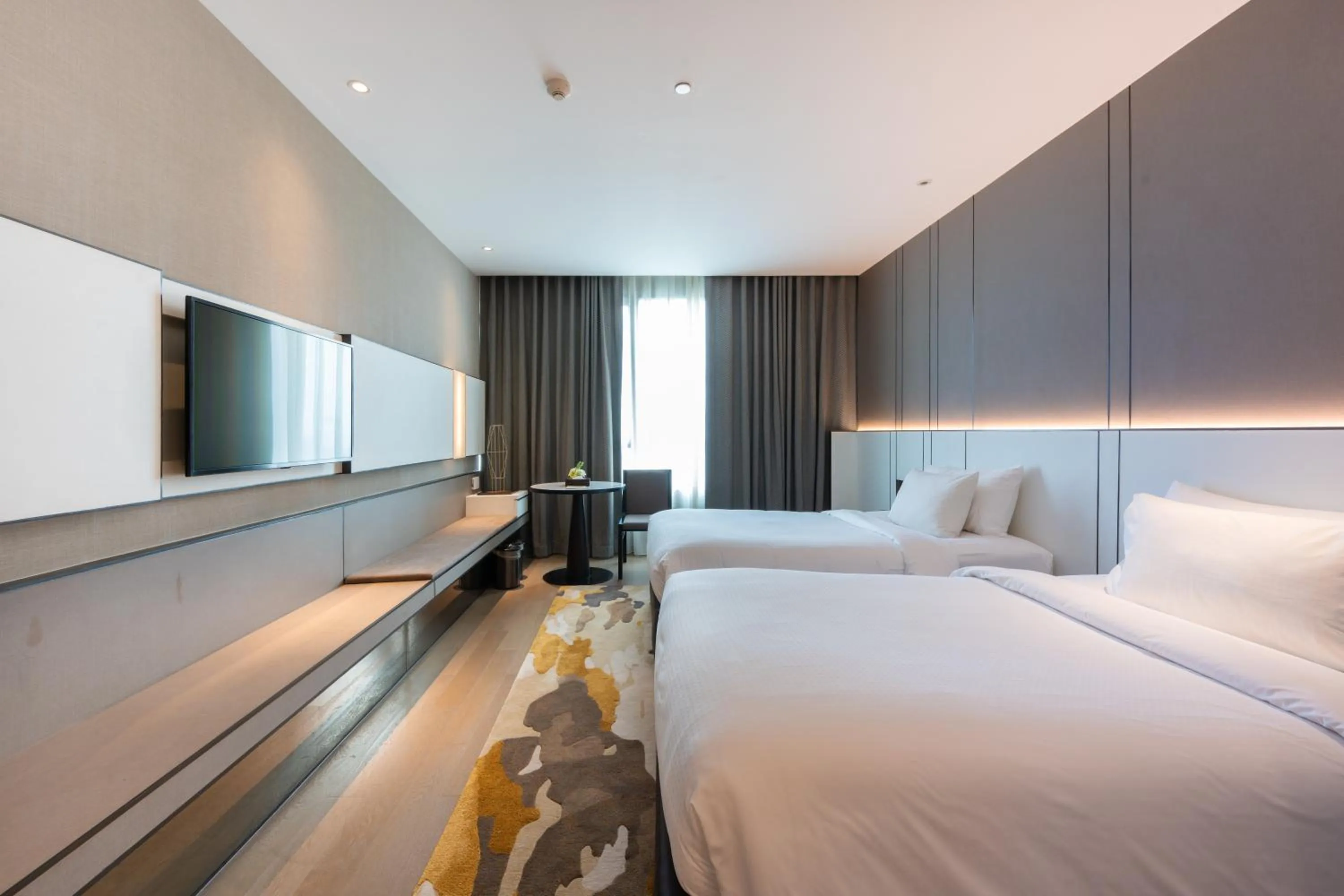 Bed in Grand Richmond Stylish Convention Hotel