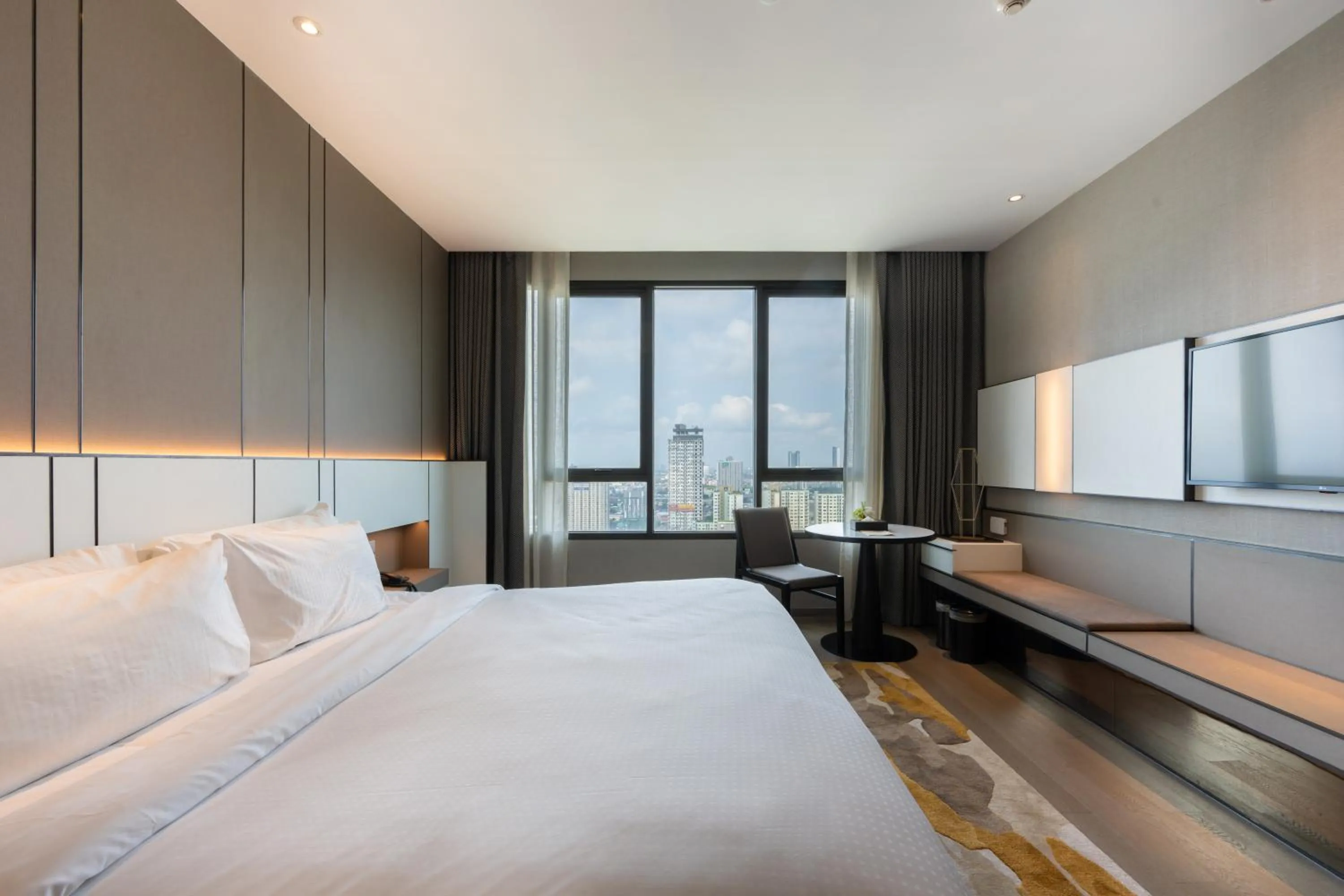 Bed in Grand Richmond Stylish Convention Hotel