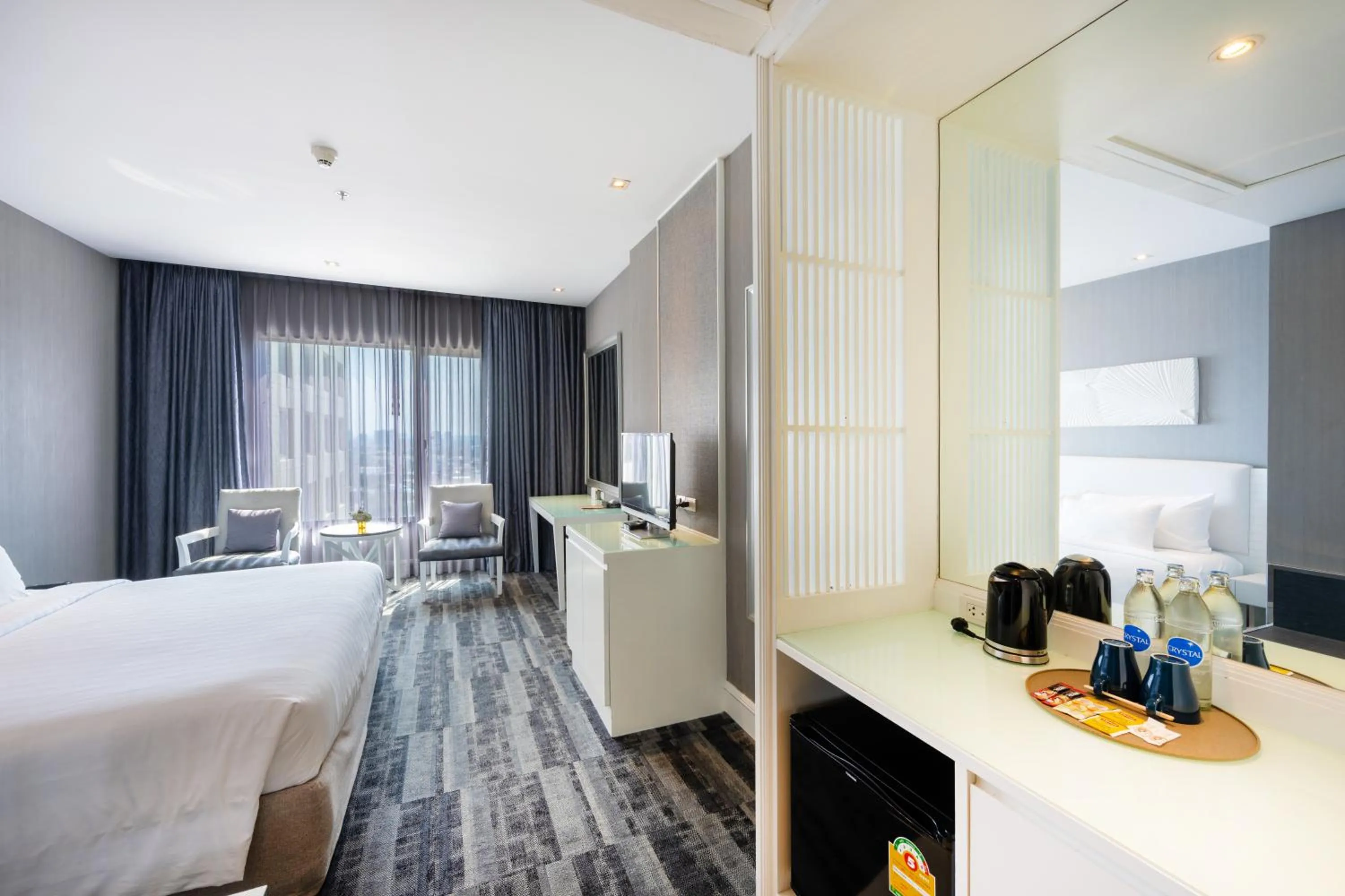 Bed in Grand Richmond Stylish Convention Hotel