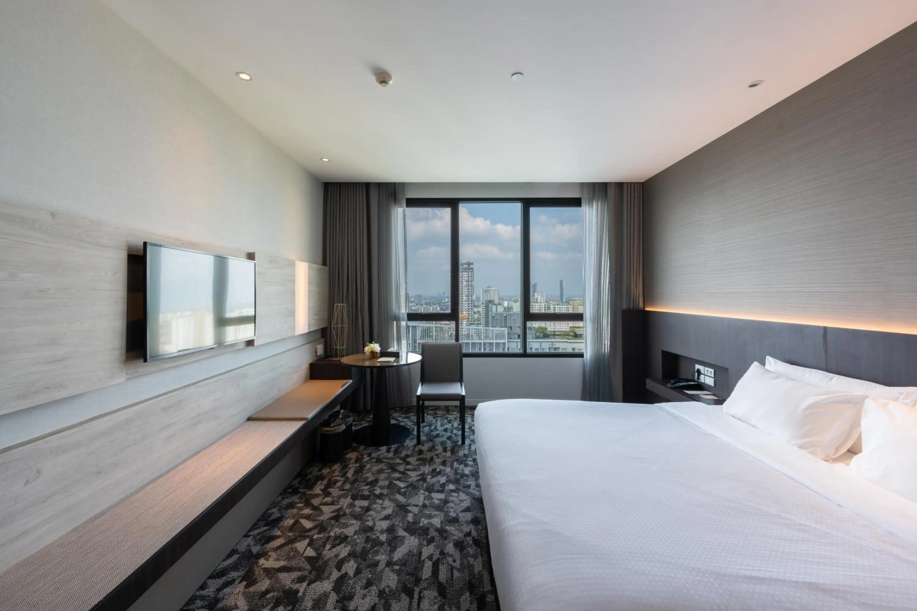 Bed in Grand Richmond Stylish Convention Hotel