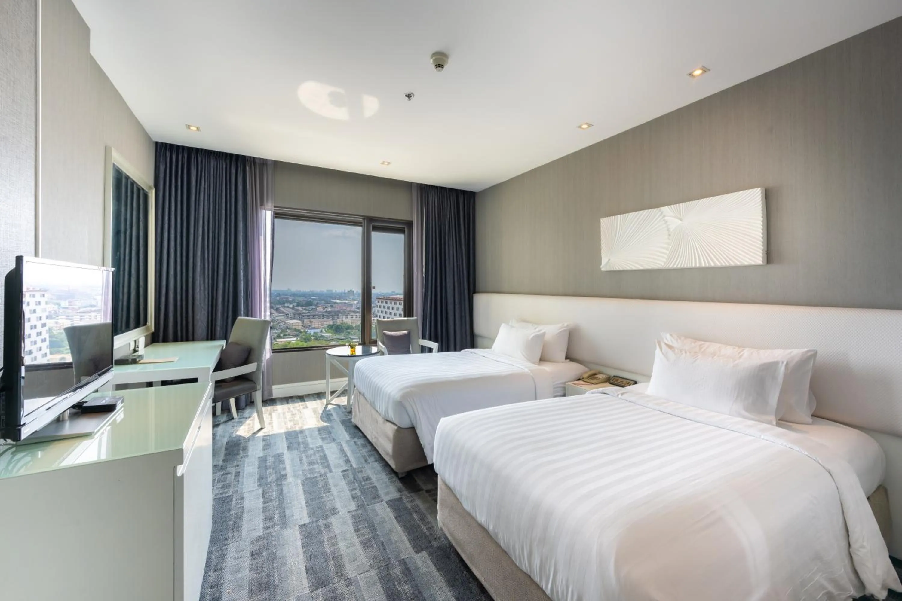 Bed in Grand Richmond Stylish Convention Hotel