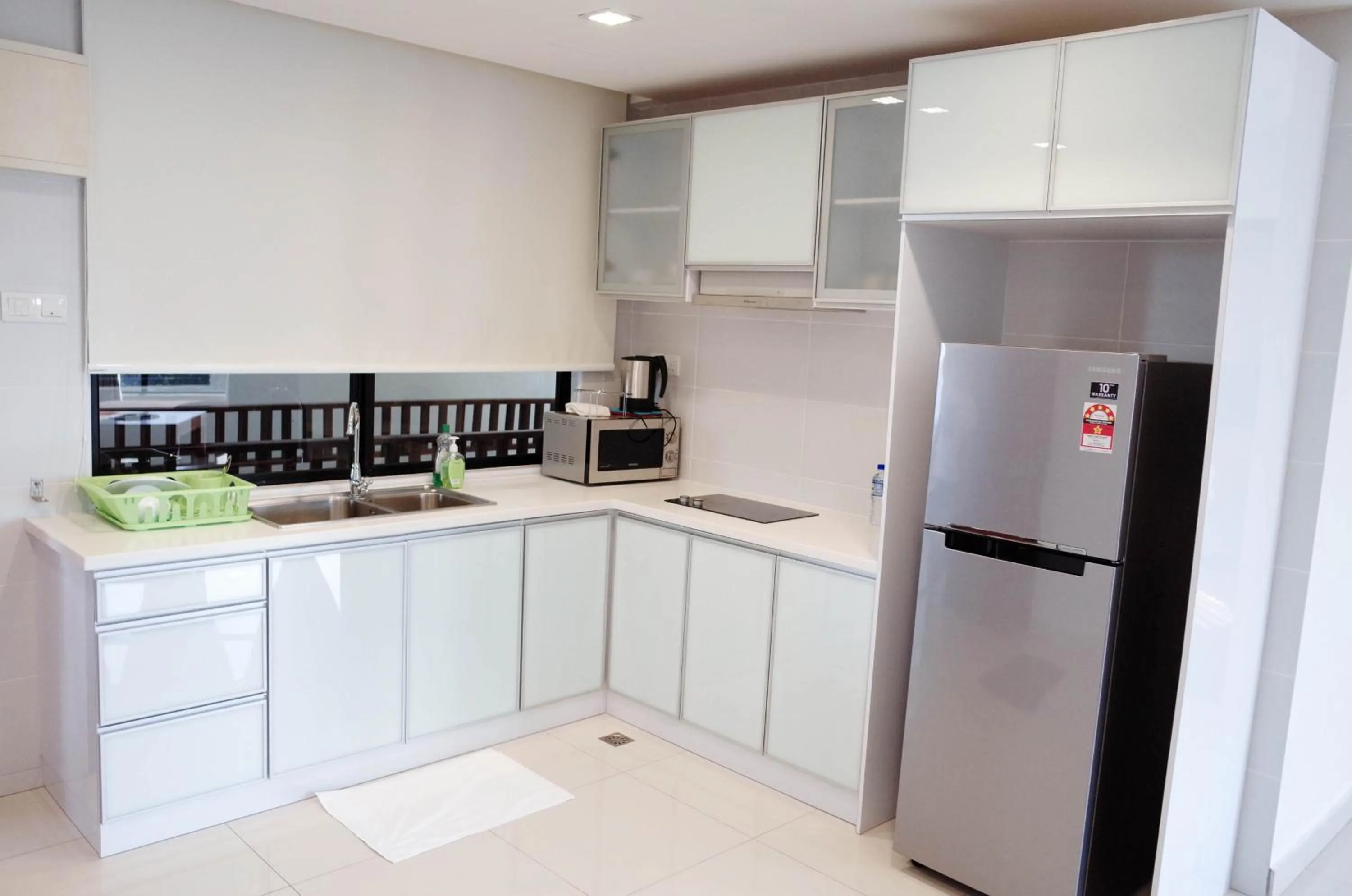 Kitchen or kitchenette in Holiday Homes At Samsuria Resort