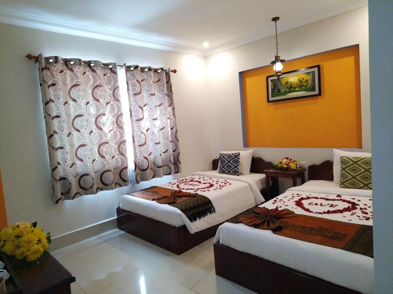 Bed in Plumeria Hotel & Spa